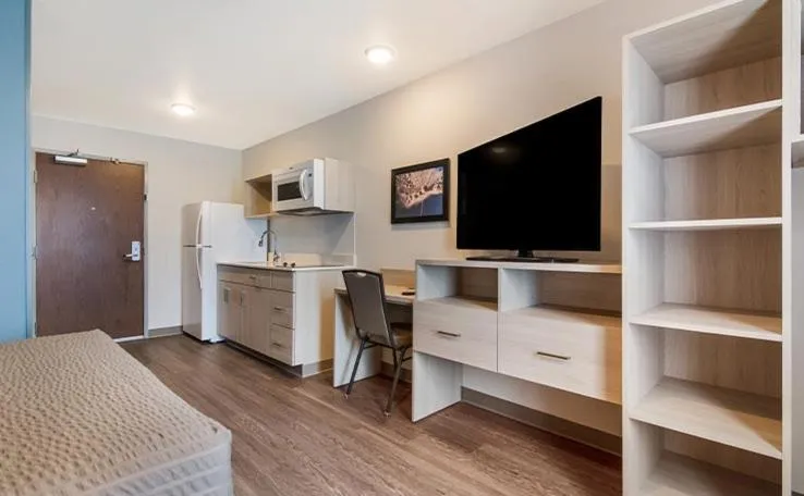 Bedroom, Bed in WoodSpring Suites Winston-Salem near Hanes Mall