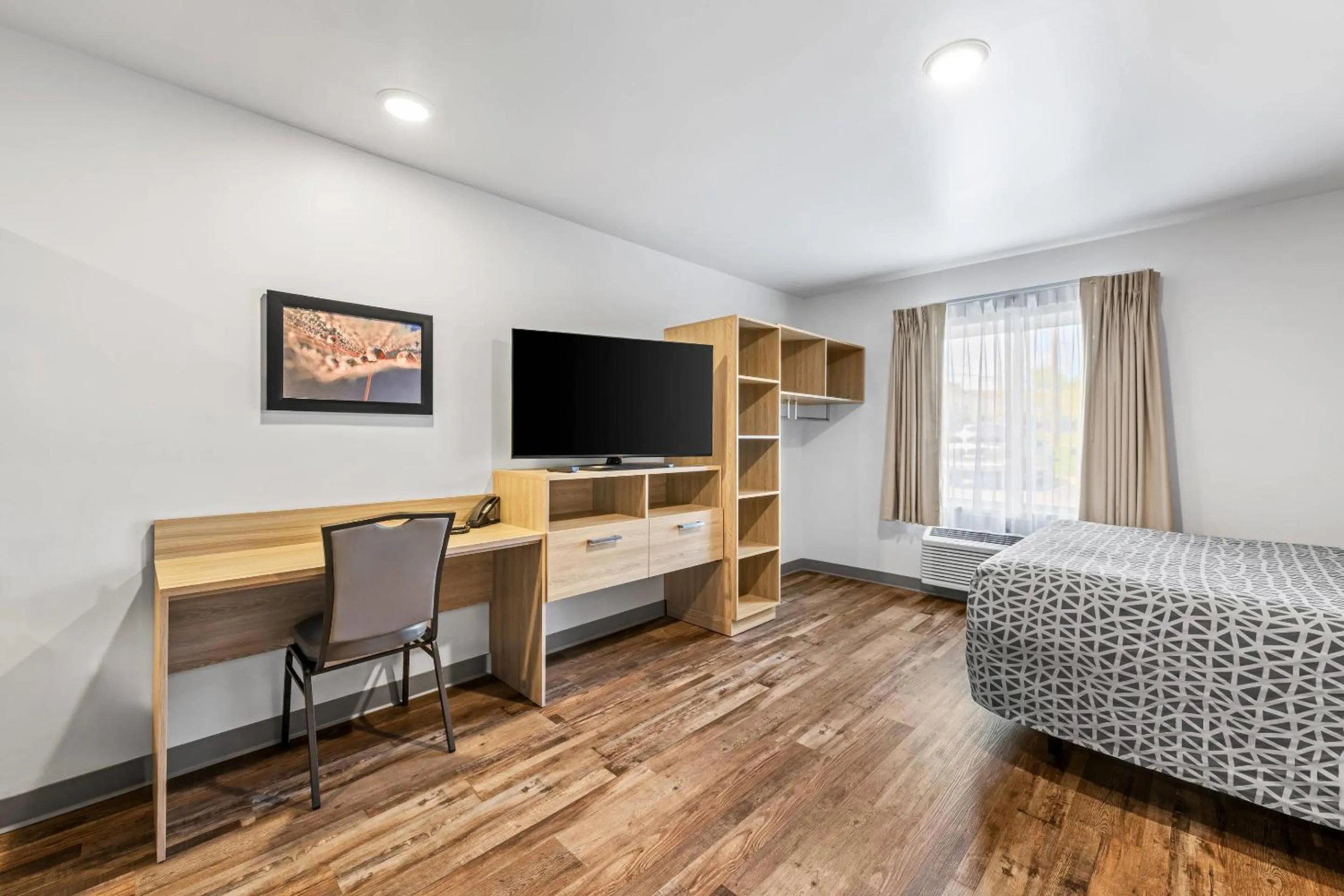 Bedroom, Bed in WoodSpring Suites Winston-Salem near Hanes Mall