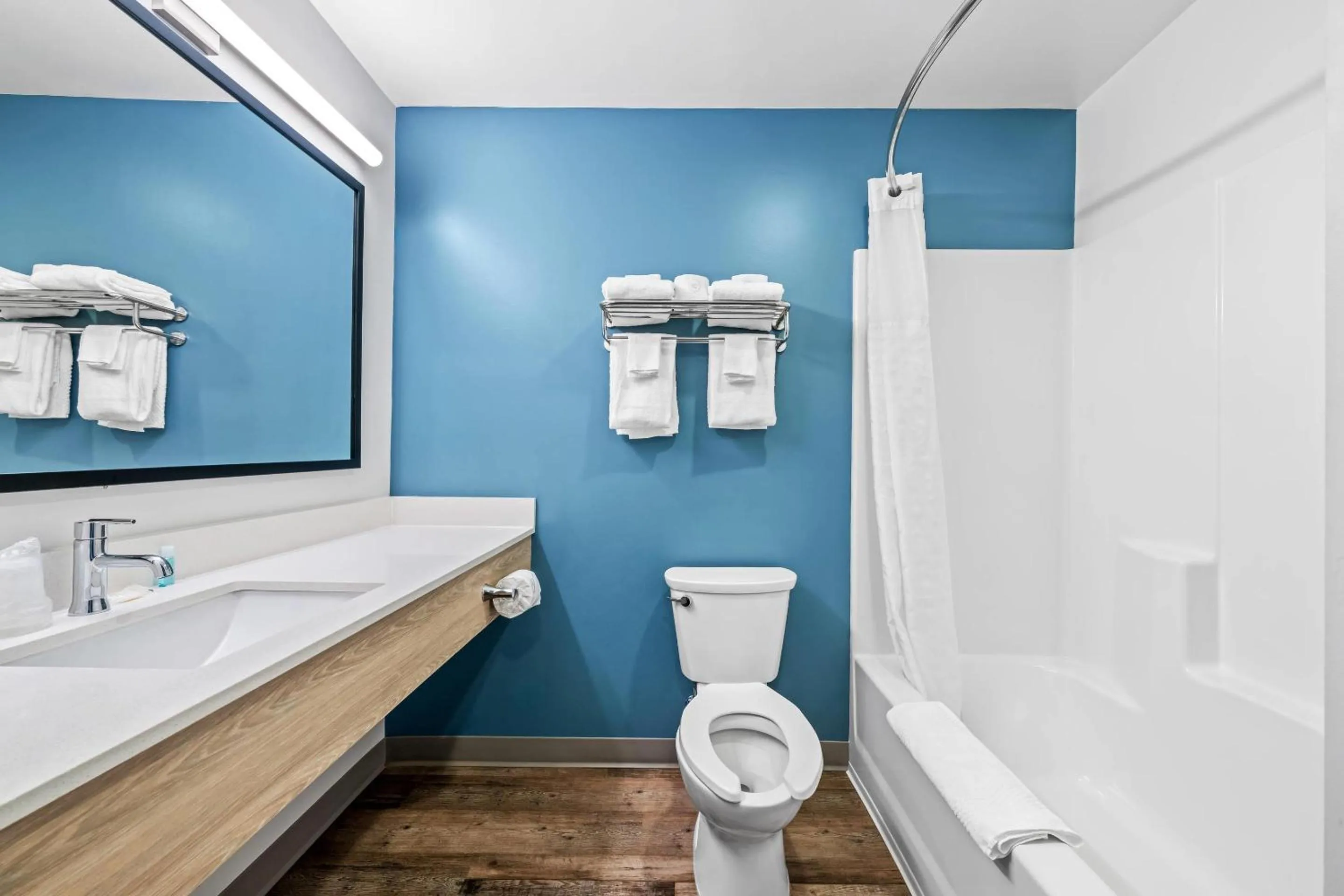 Bedroom in WoodSpring Suites Winston-Salem near Hanes Mall