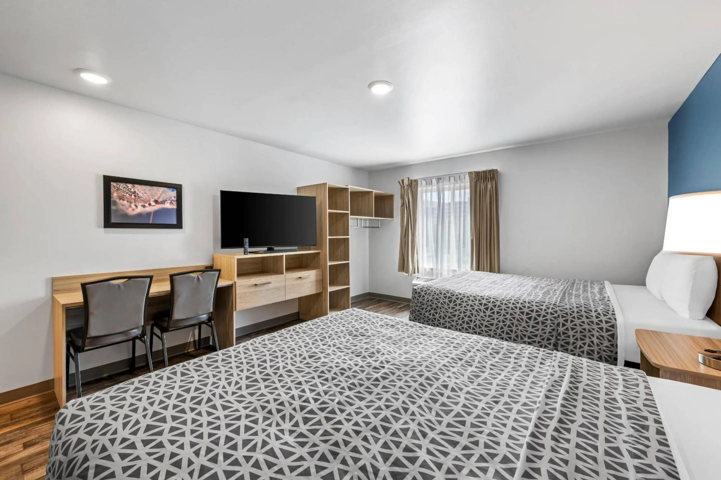 Bedroom, Bed in WoodSpring Suites Winston-Salem near Hanes Mall