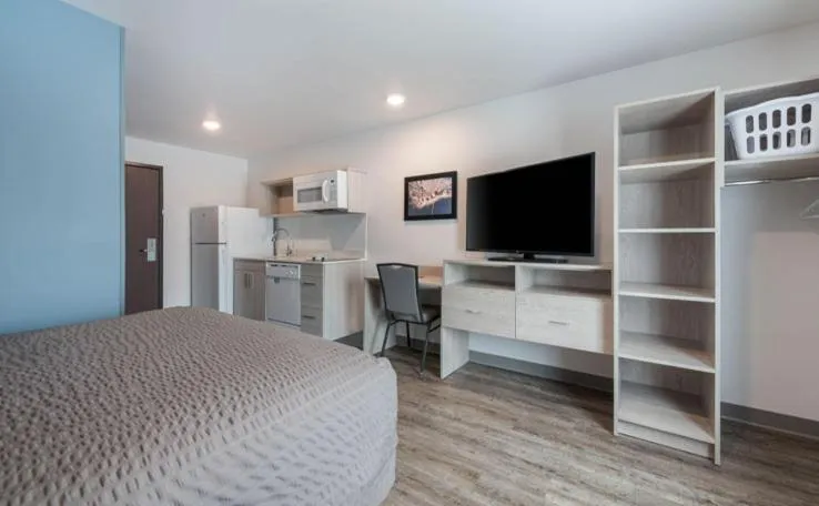 Bedroom in WoodSpring Suites Winston-Salem near Hanes Mall