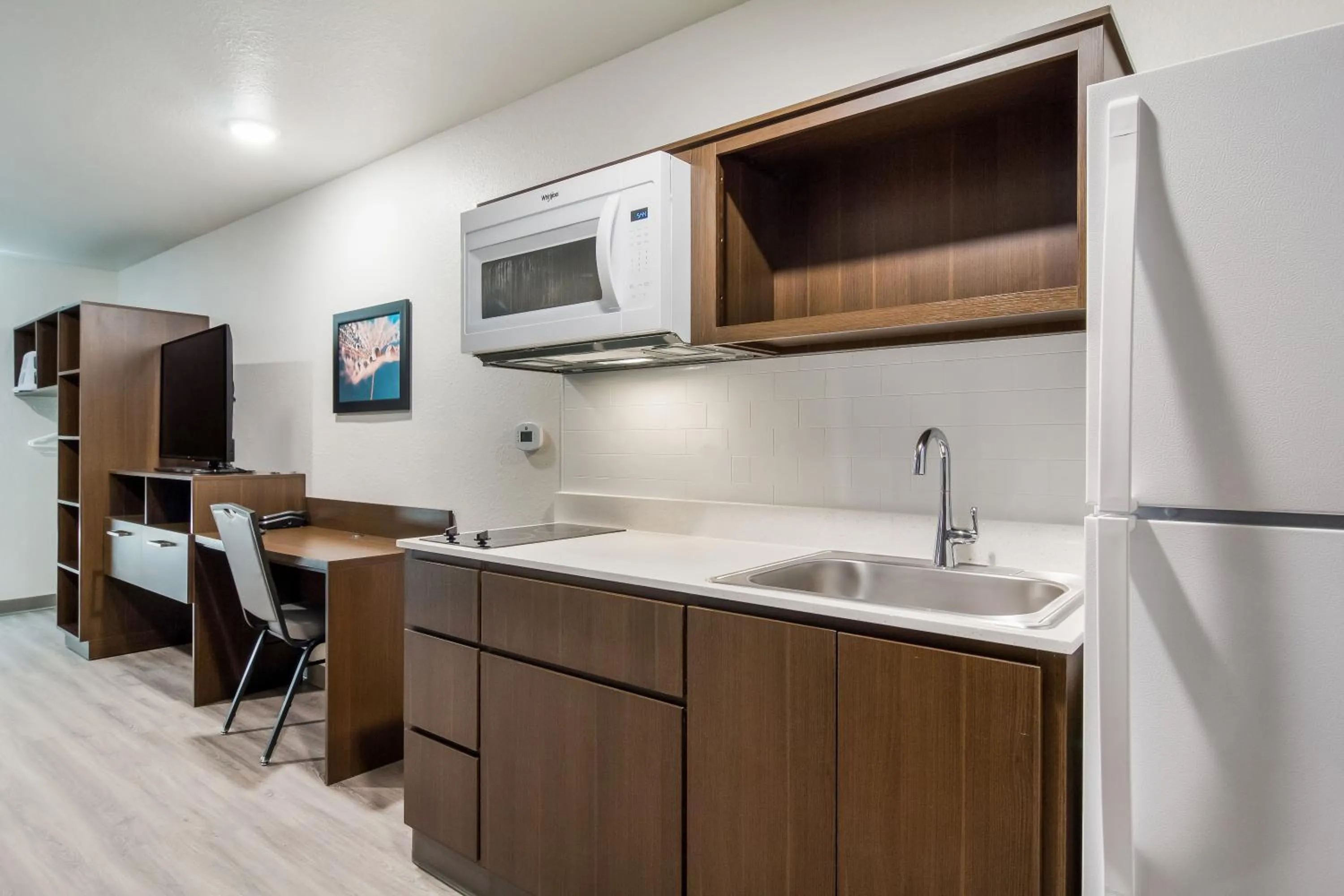 Kitchen or kitchenette in WoodSpring Suites Winston-Salem near Hanes Mall