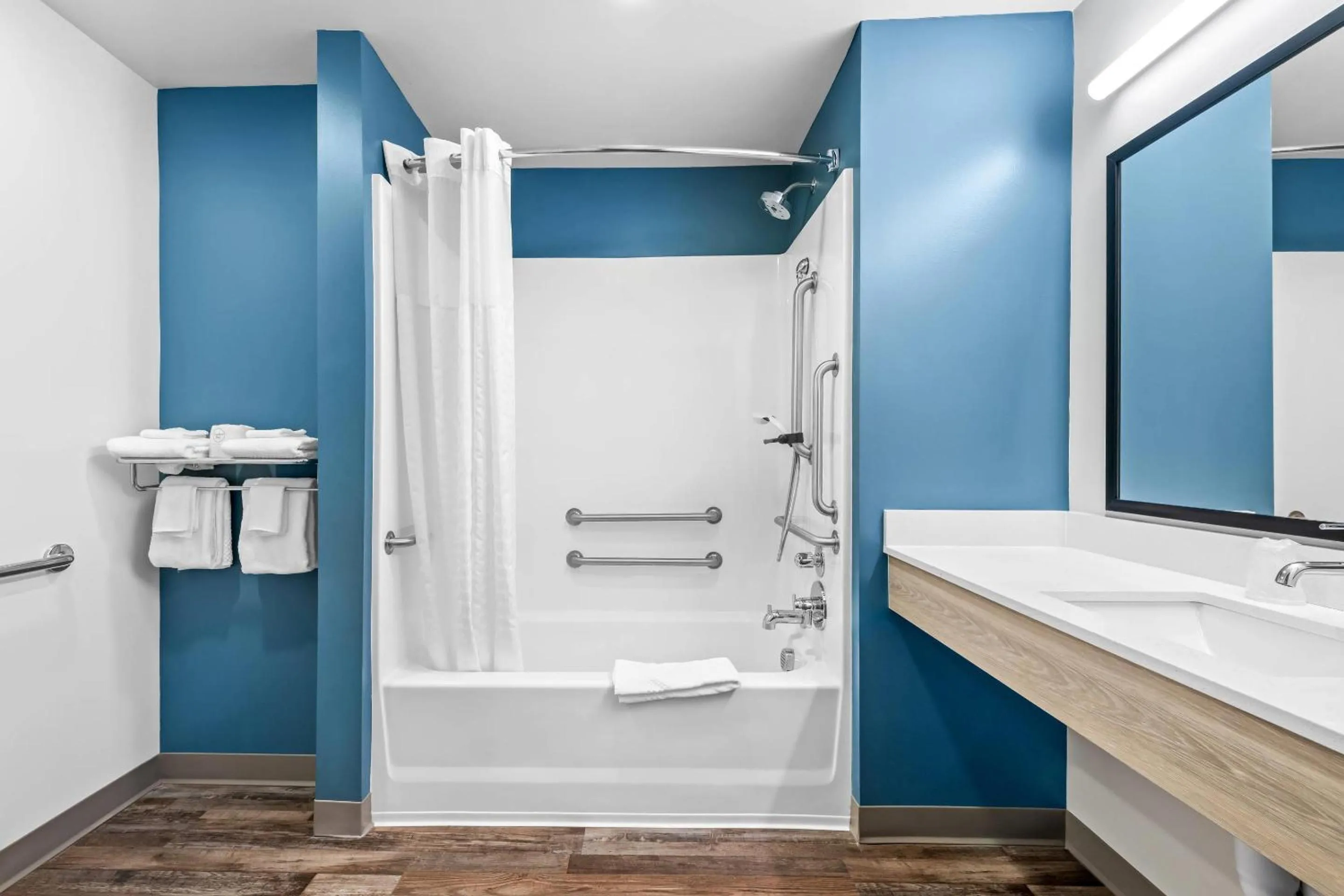 Bedroom in WoodSpring Suites Winston-Salem near Hanes Mall