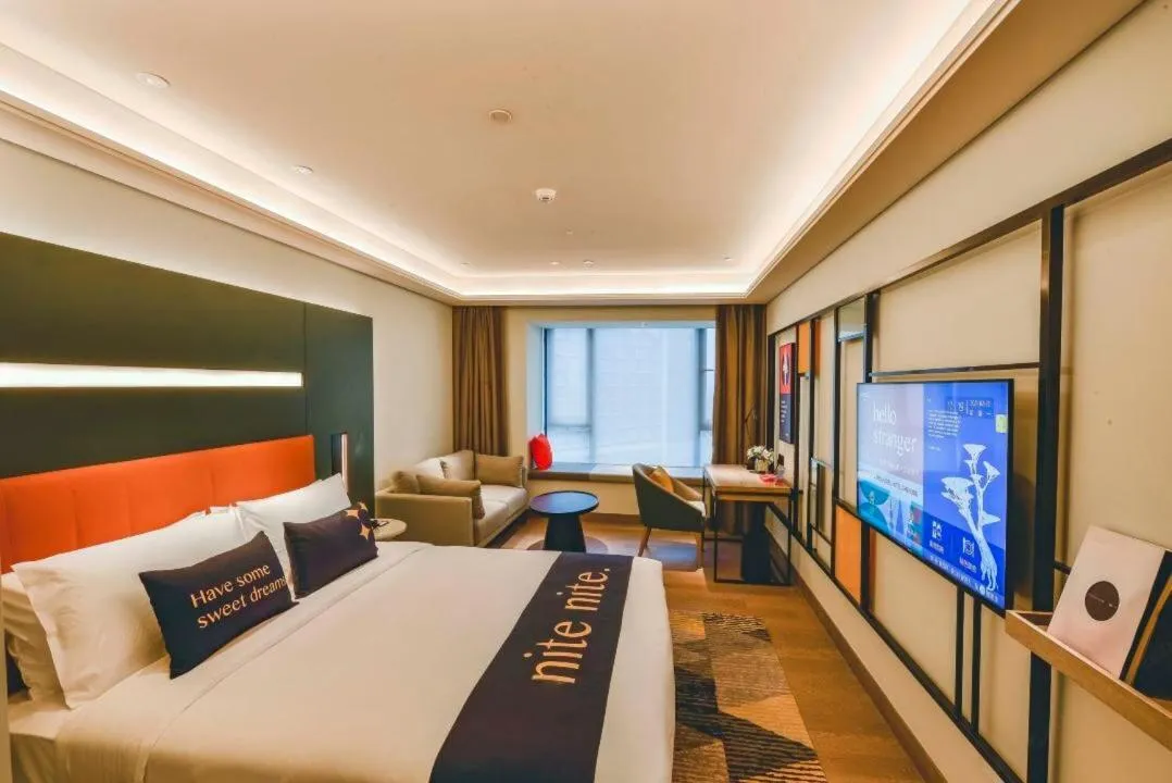 Bed in MUSTEL Hotel Guangzhou Nansha