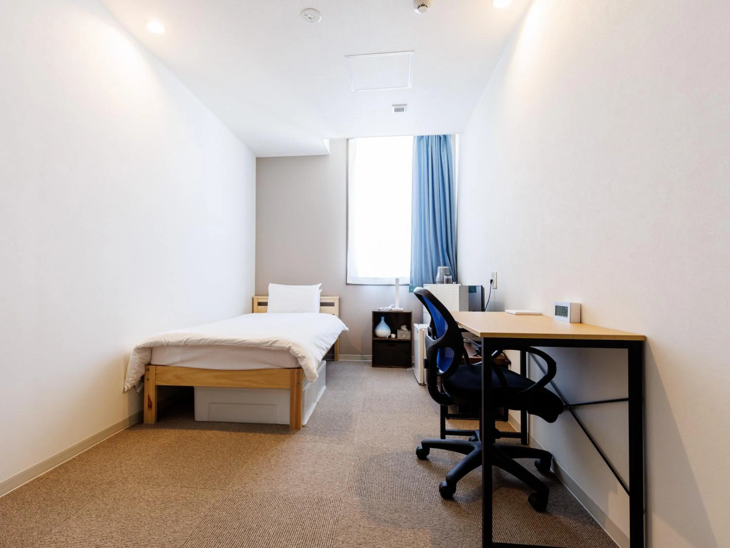 Bed in Tabist Kitami Athlete Stays