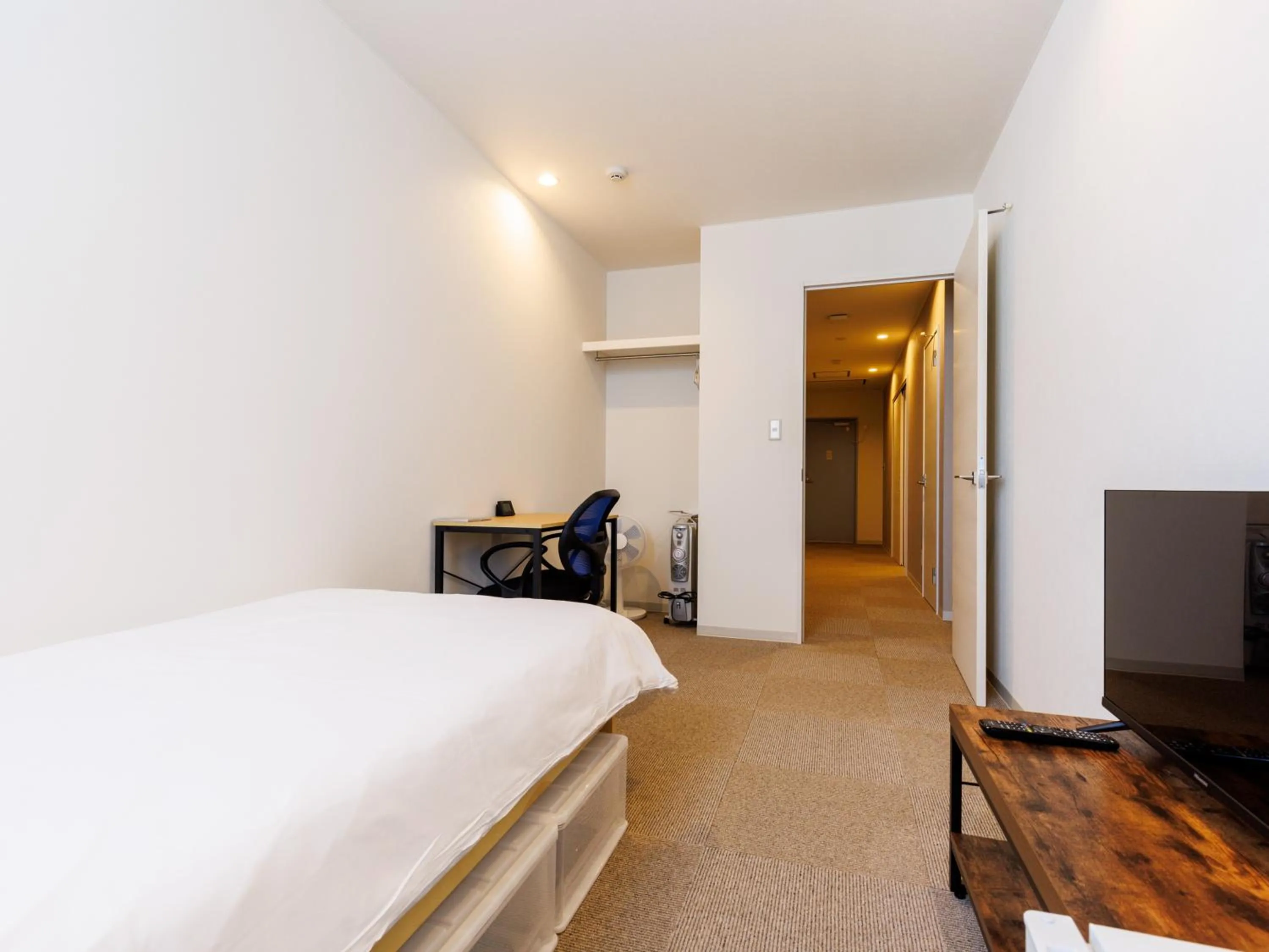 Bed in Tabist Kitami Athlete Stays