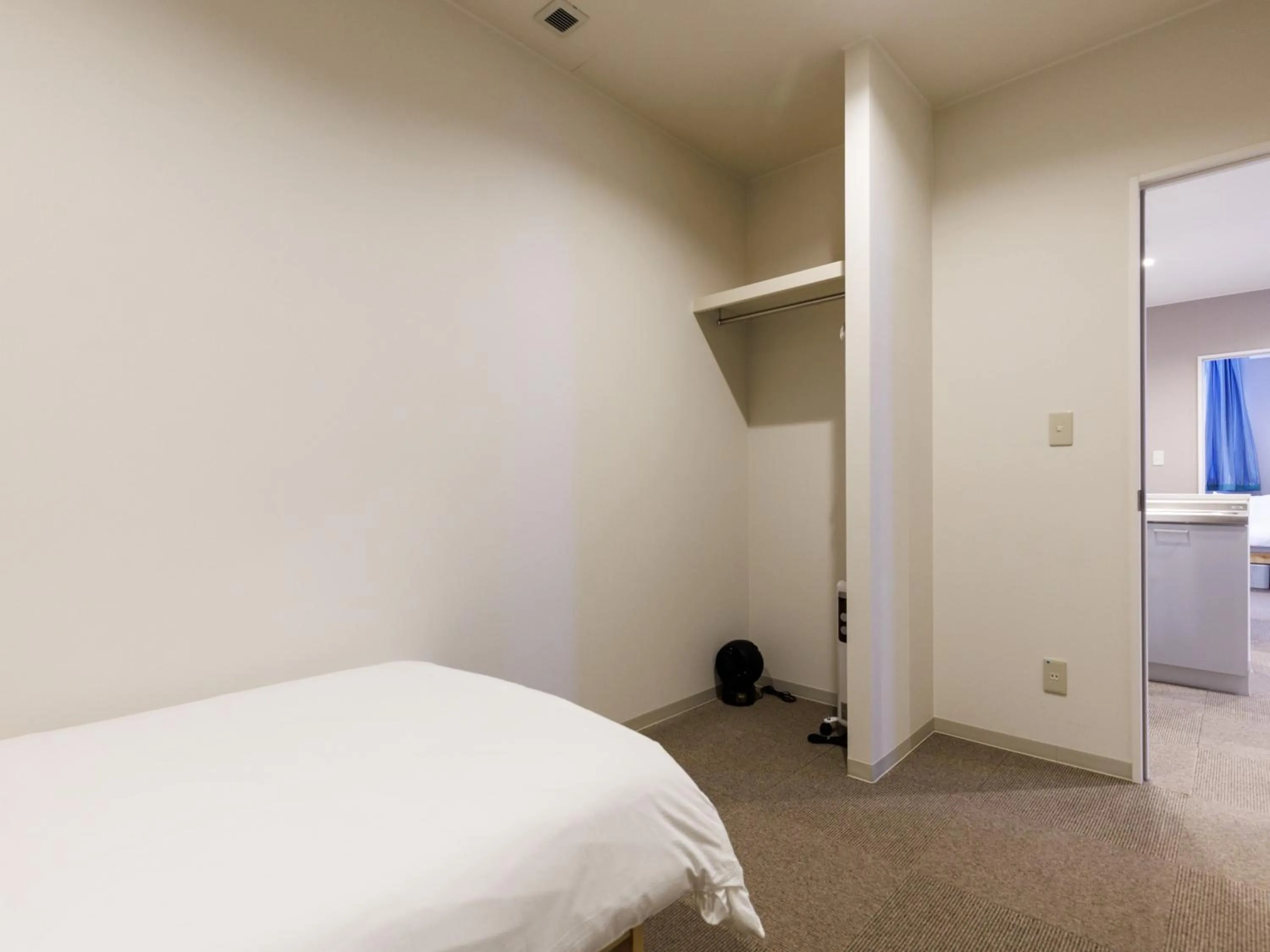 Bed in Tabist Kitami Athlete Stays