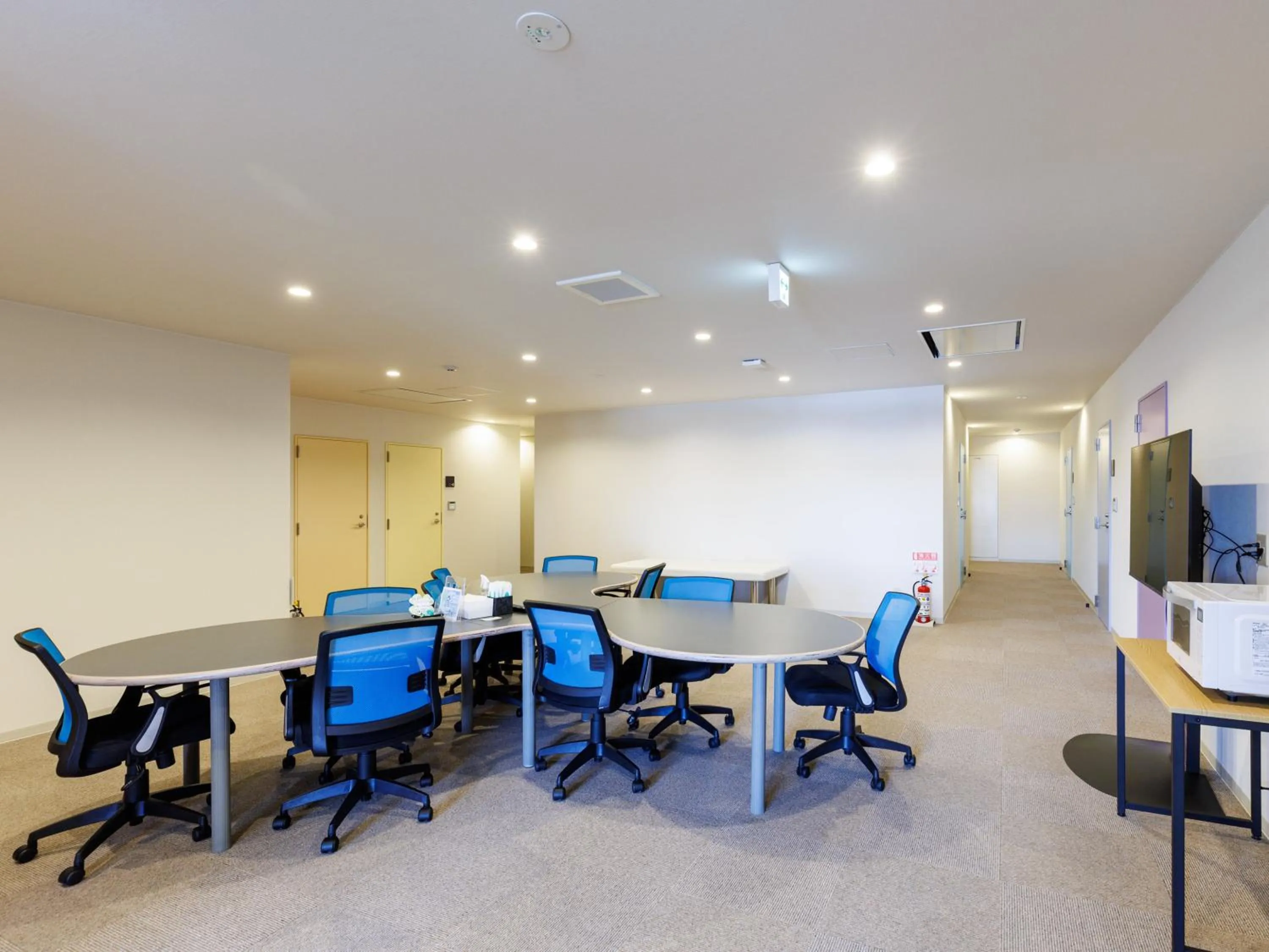 Communal lounge/ TV room in Tabist Kitami Athlete Stays