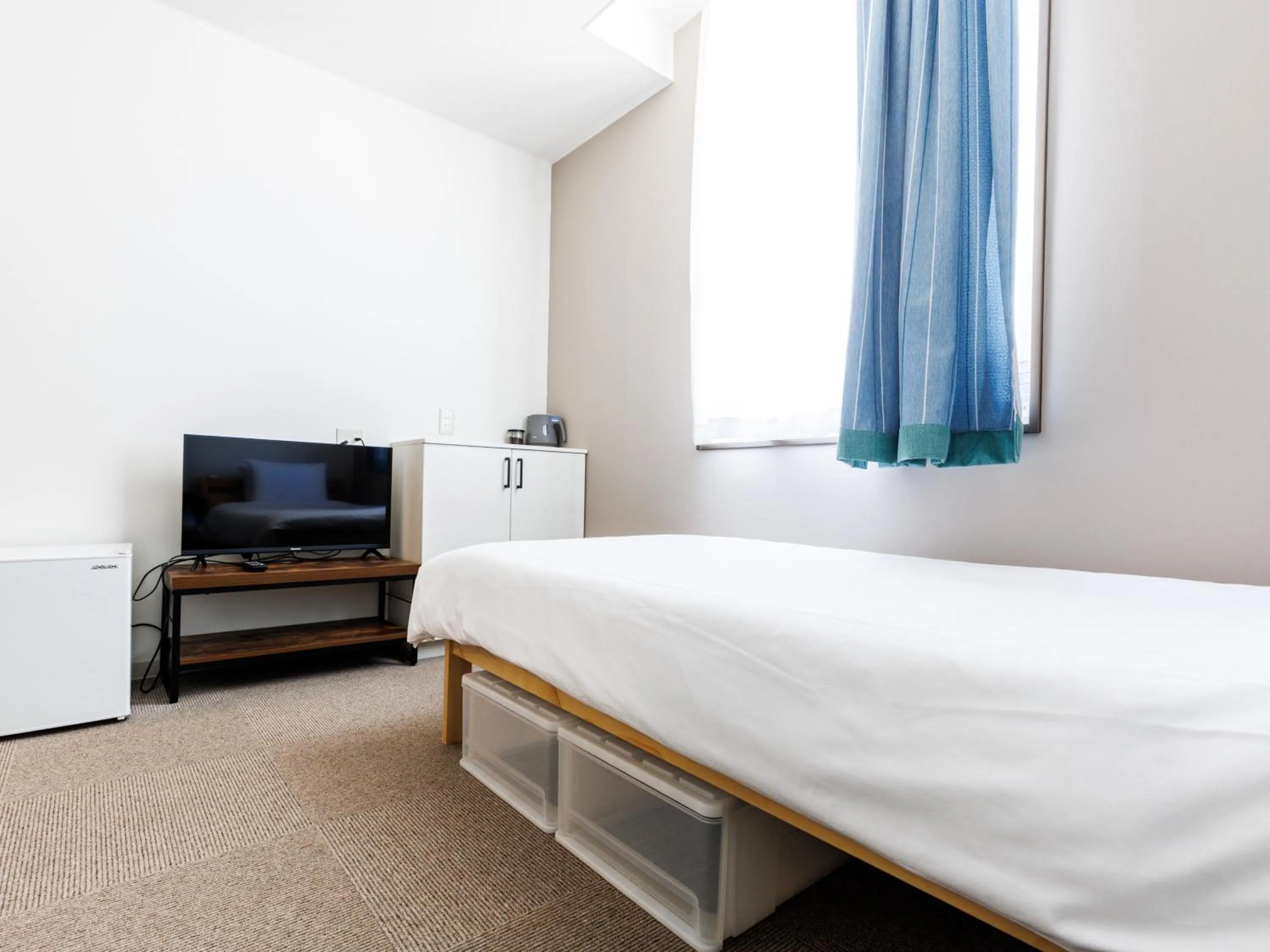 Bed in Tabist Kitami Athlete Stays