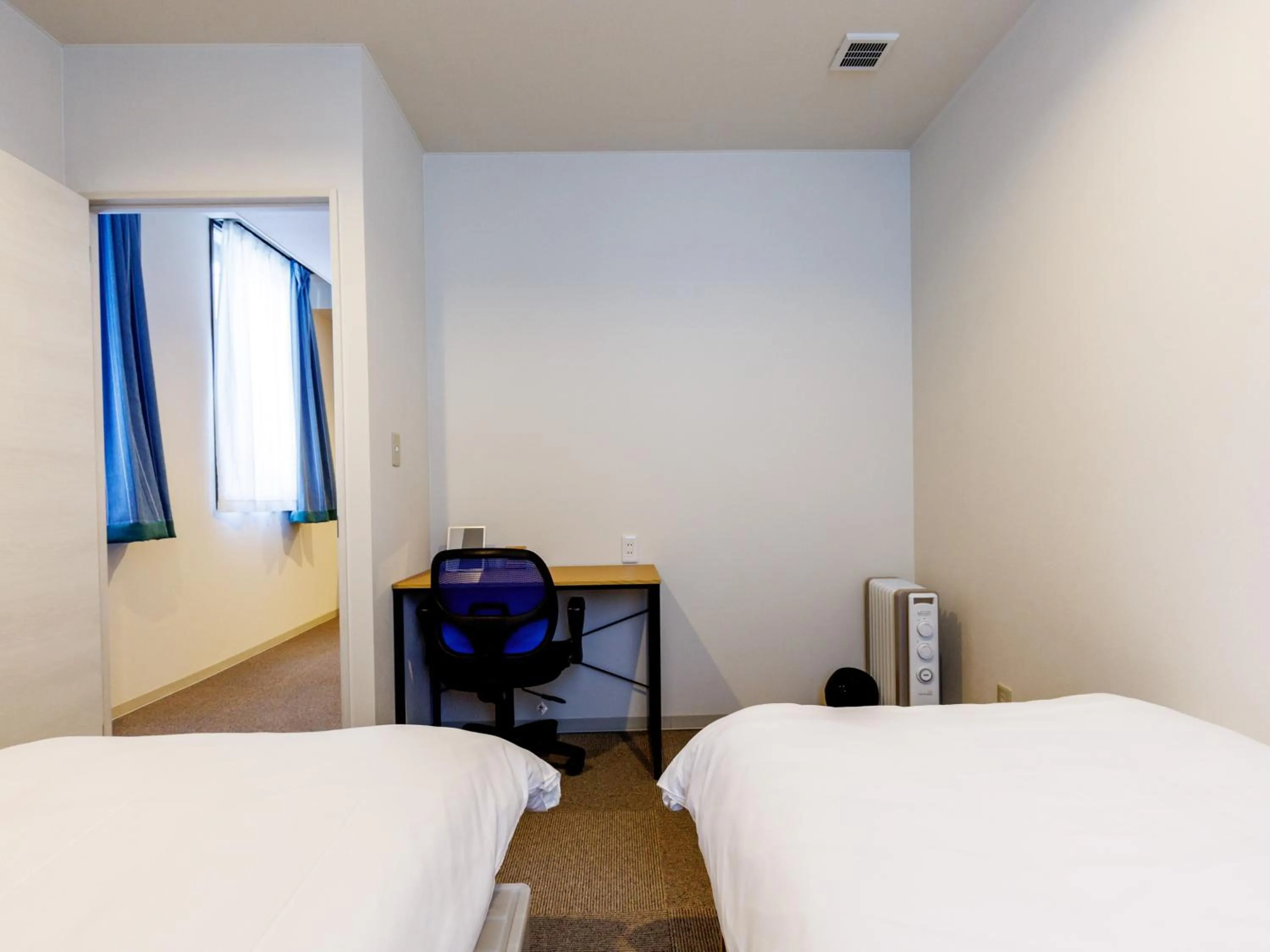 Bed in Tabist Kitami Athlete Stays