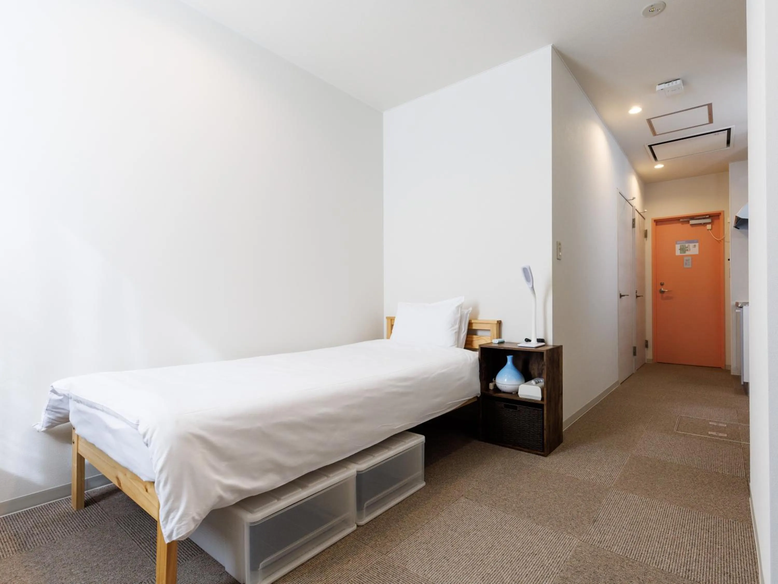 Bed in Tabist Kitami Athlete Stays