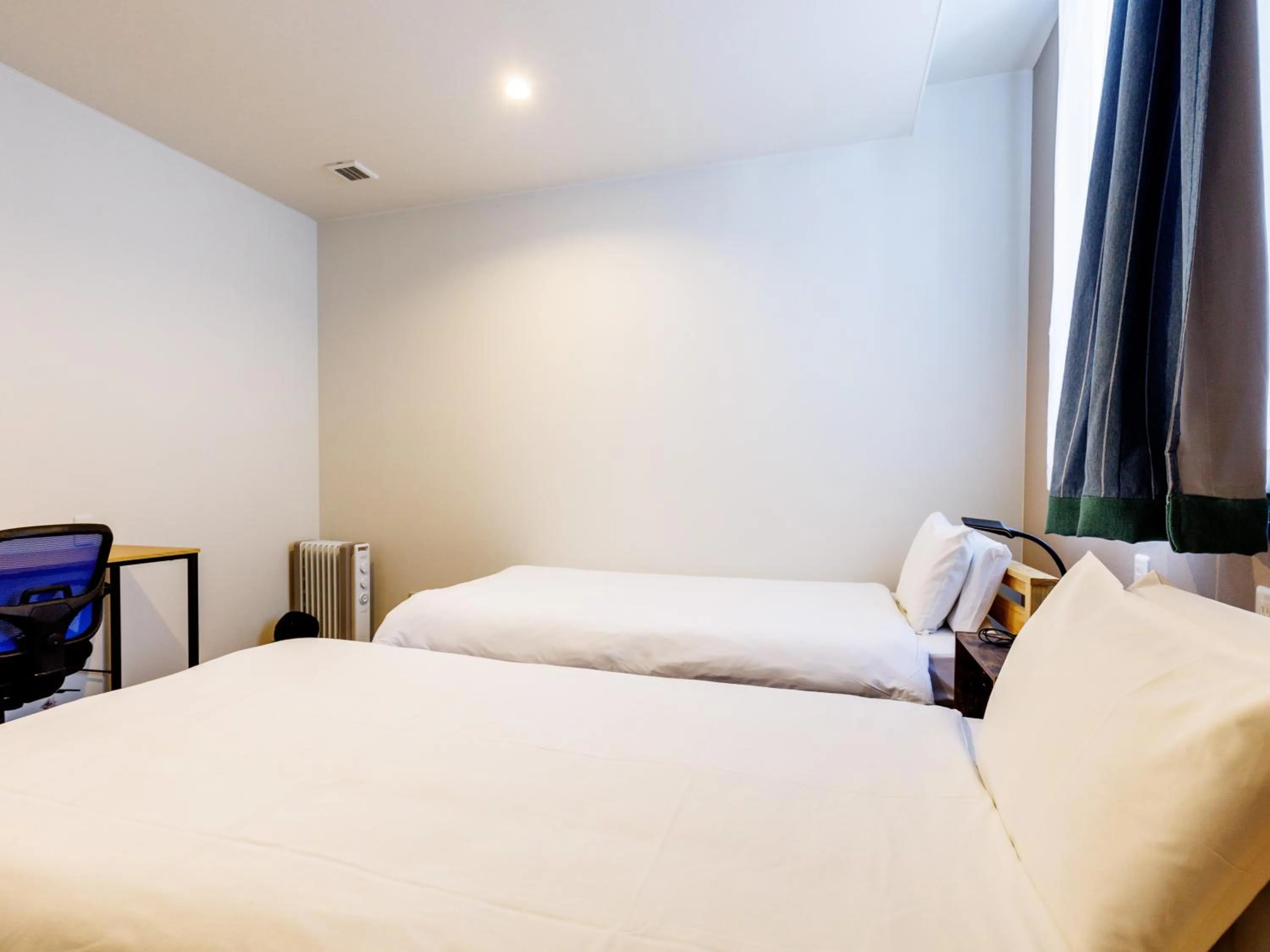 Bed in Tabist Kitami Athlete Stays