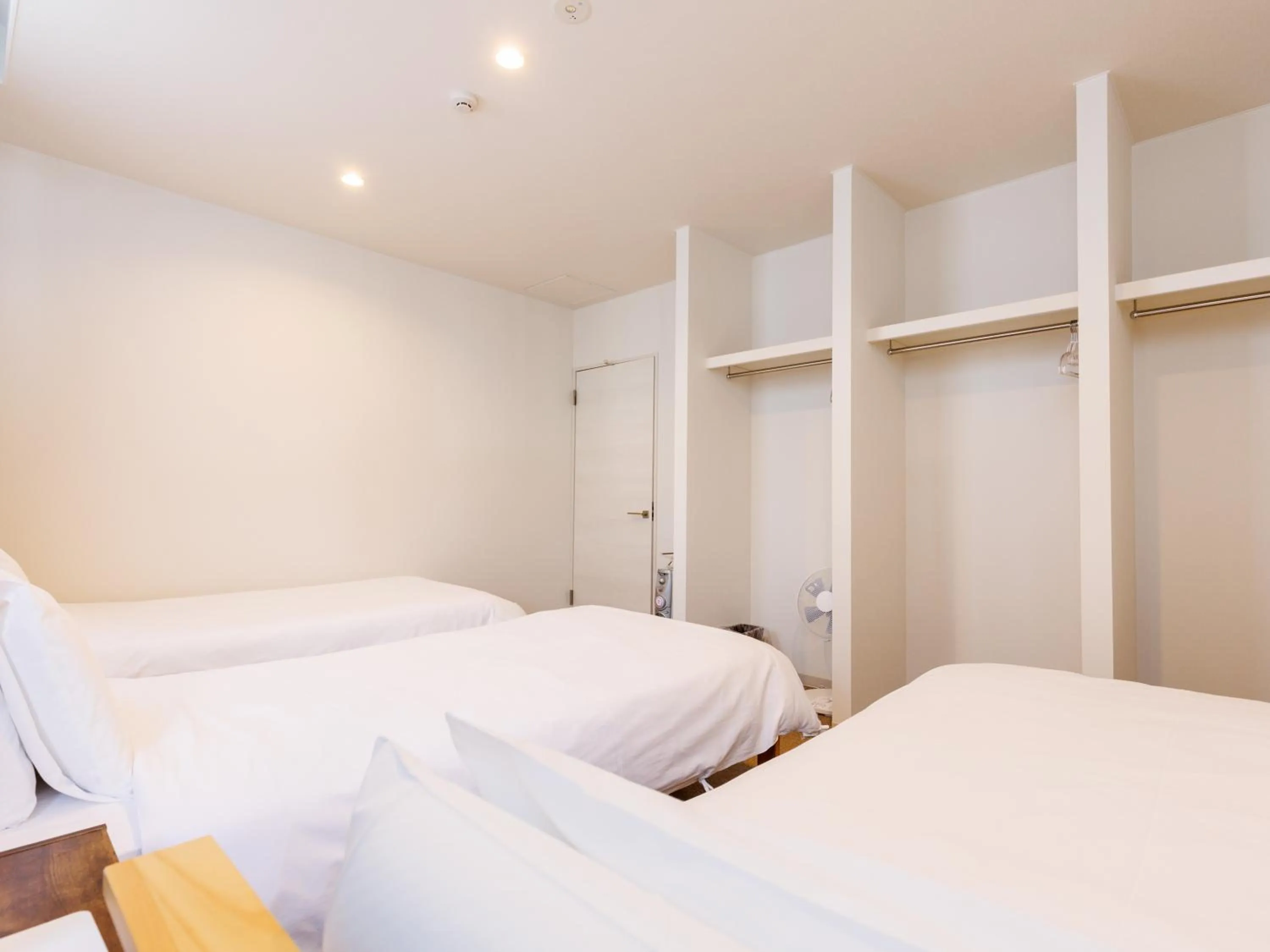 Bed in Tabist Kitami Athlete Stays