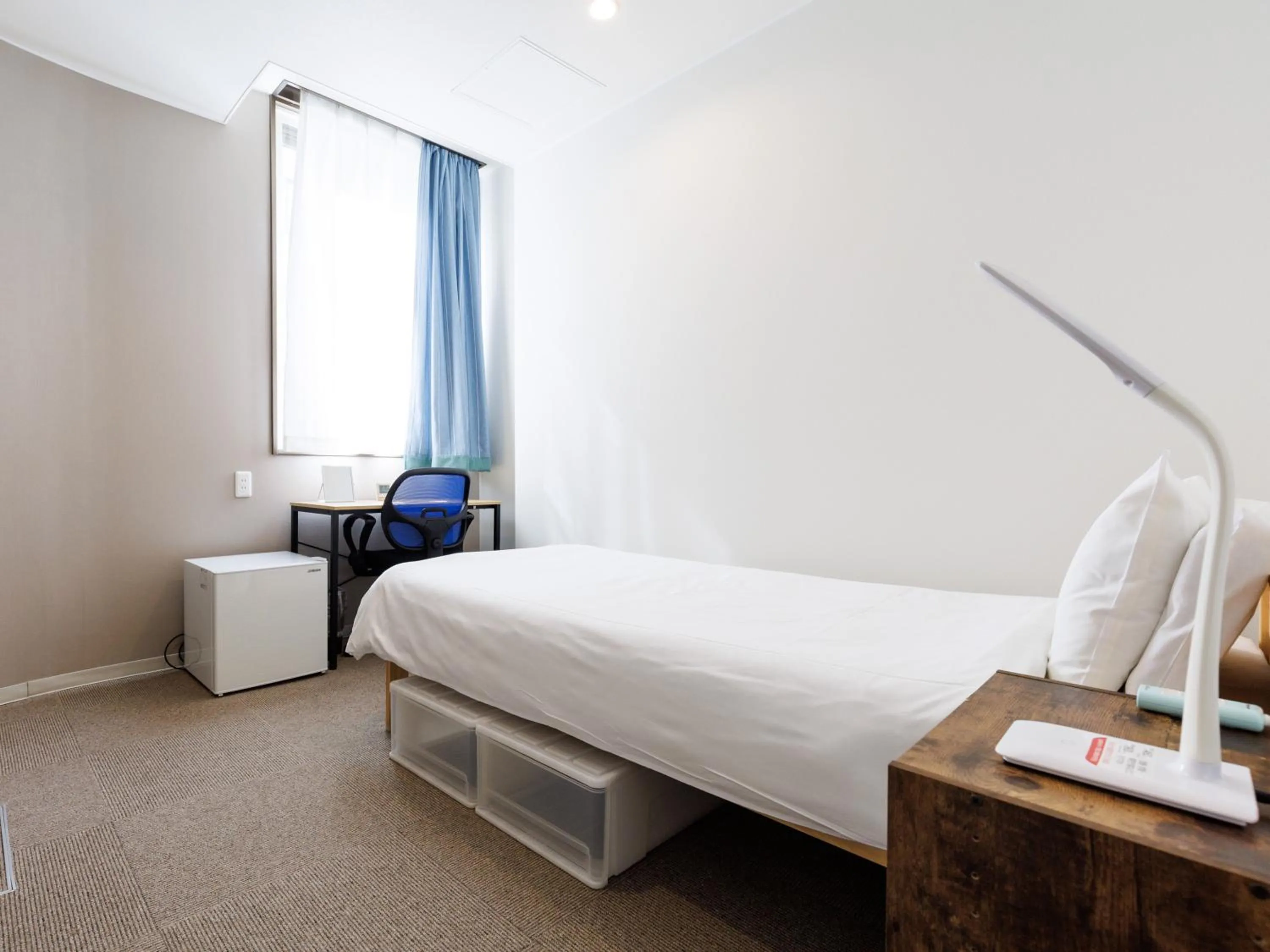 Bed in Tabist Kitami Athlete Stays