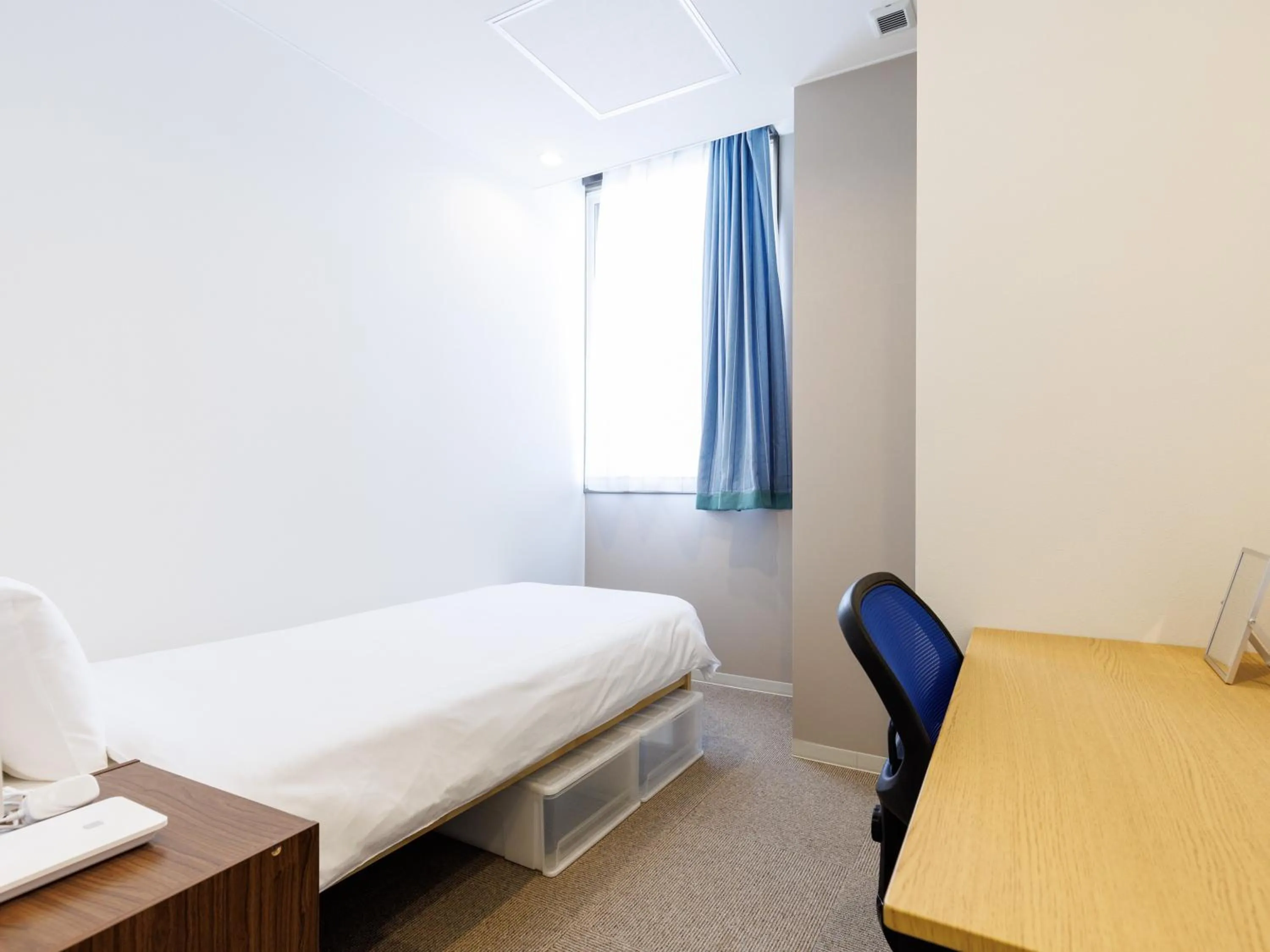 Bed in Tabist Kitami Athlete Stays