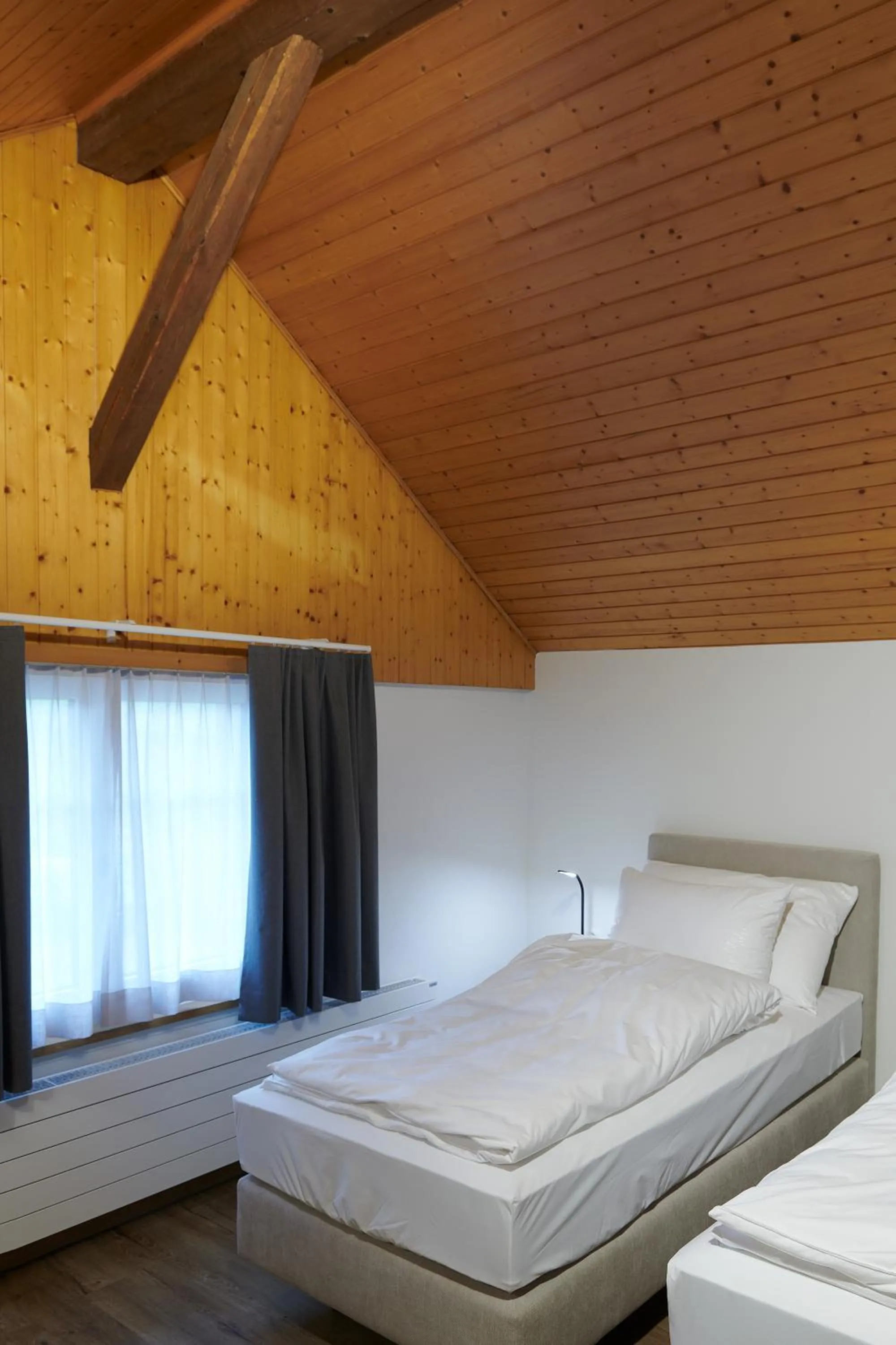 Bed in Hotel Jäger Jeuss - Murten - Self-Check-in