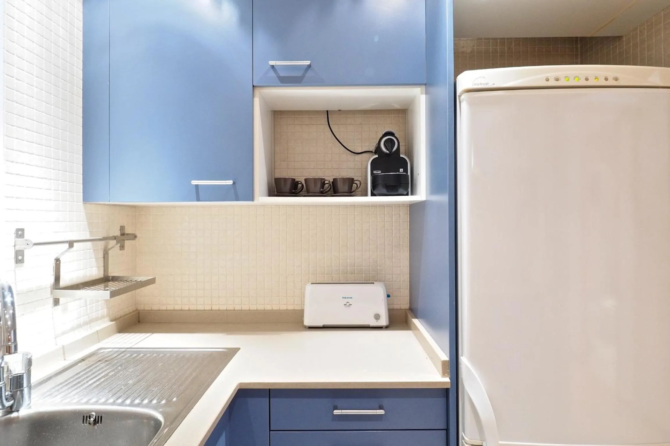 Kitchen or kitchenette in Suites Barcelona Park Güell