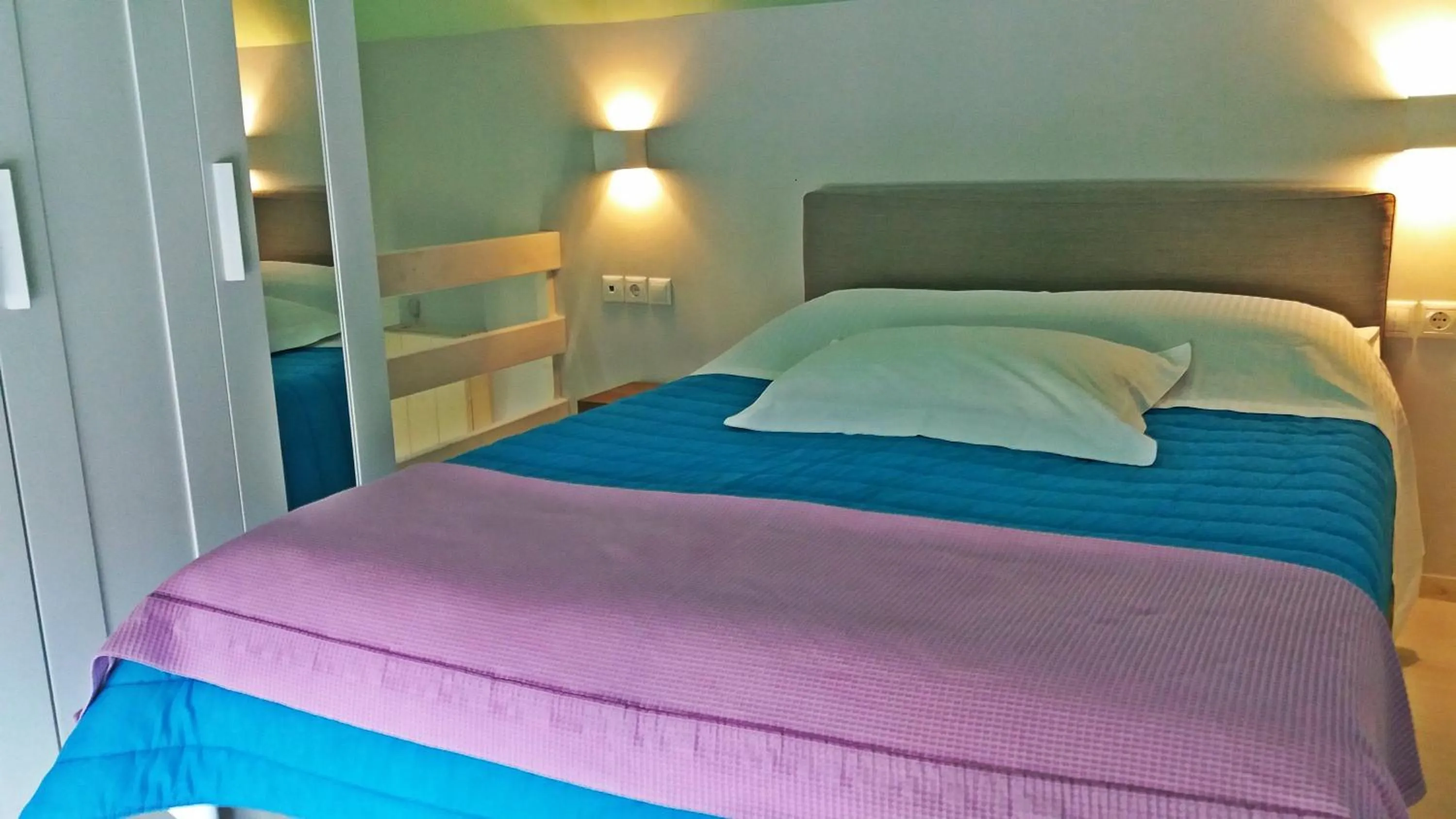 Bed in Derveni Luxury Apartments