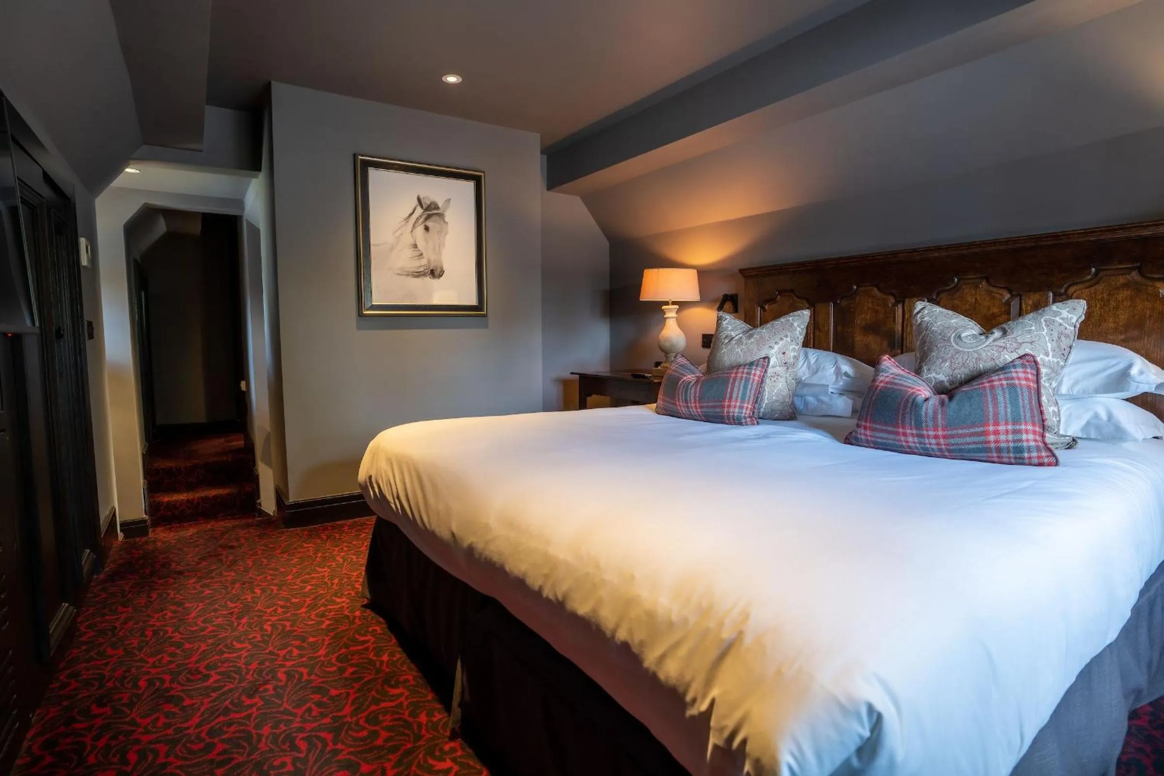 Bed in The Lygon Arms - an Iconic Luxury Hotel