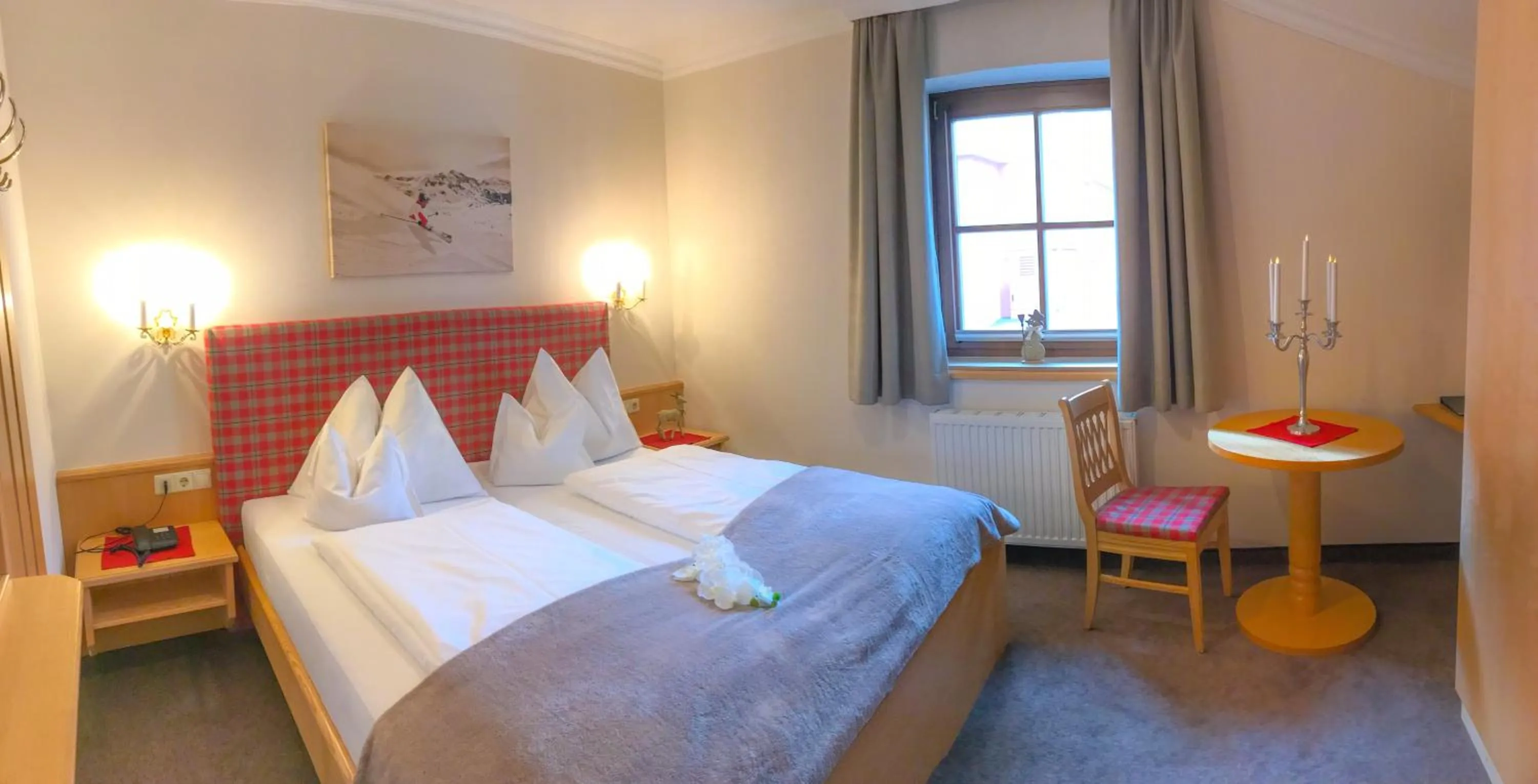 Bed in Andi's Skihotel