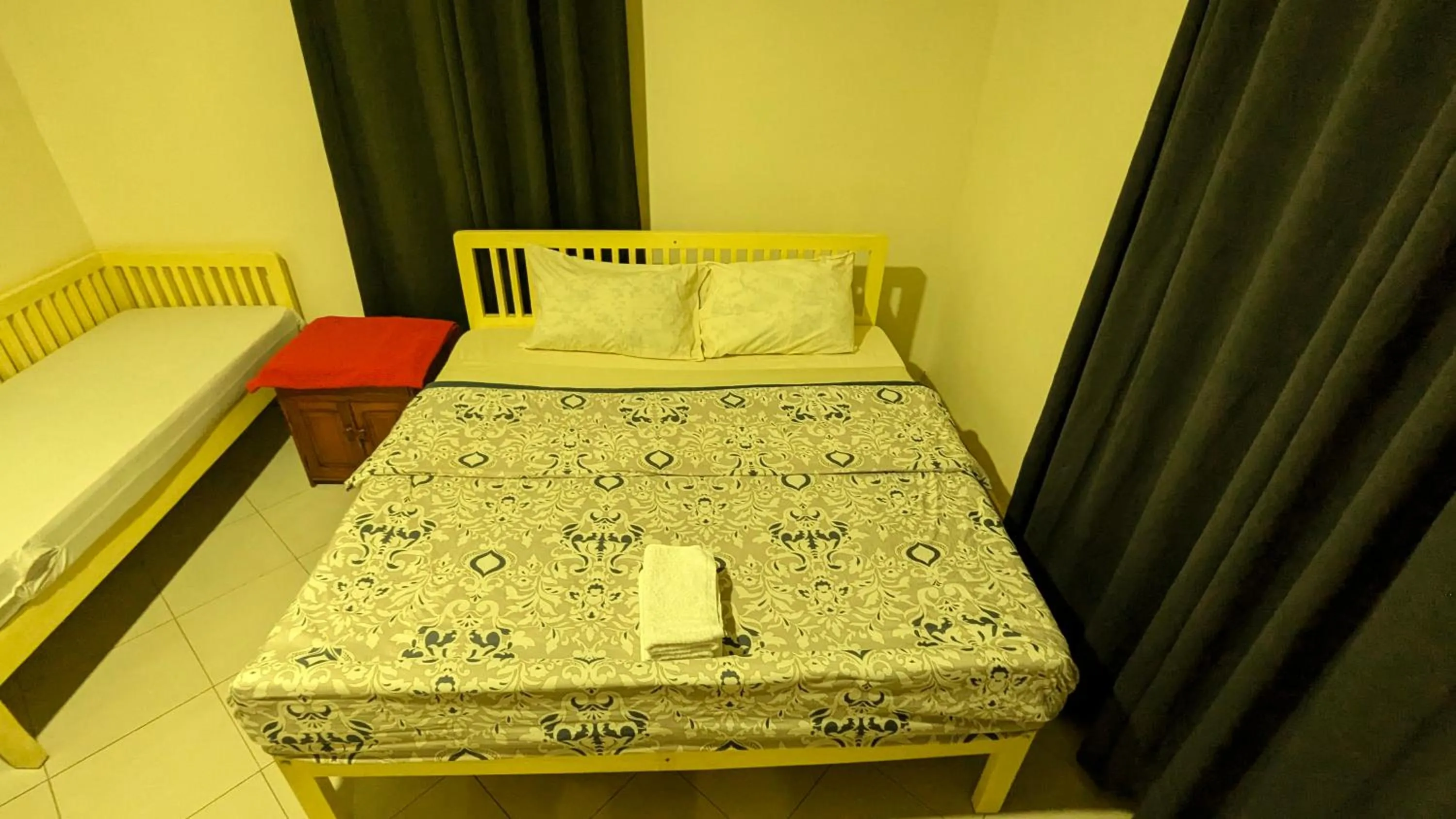 Bed in JACARANDA HOMESTAY