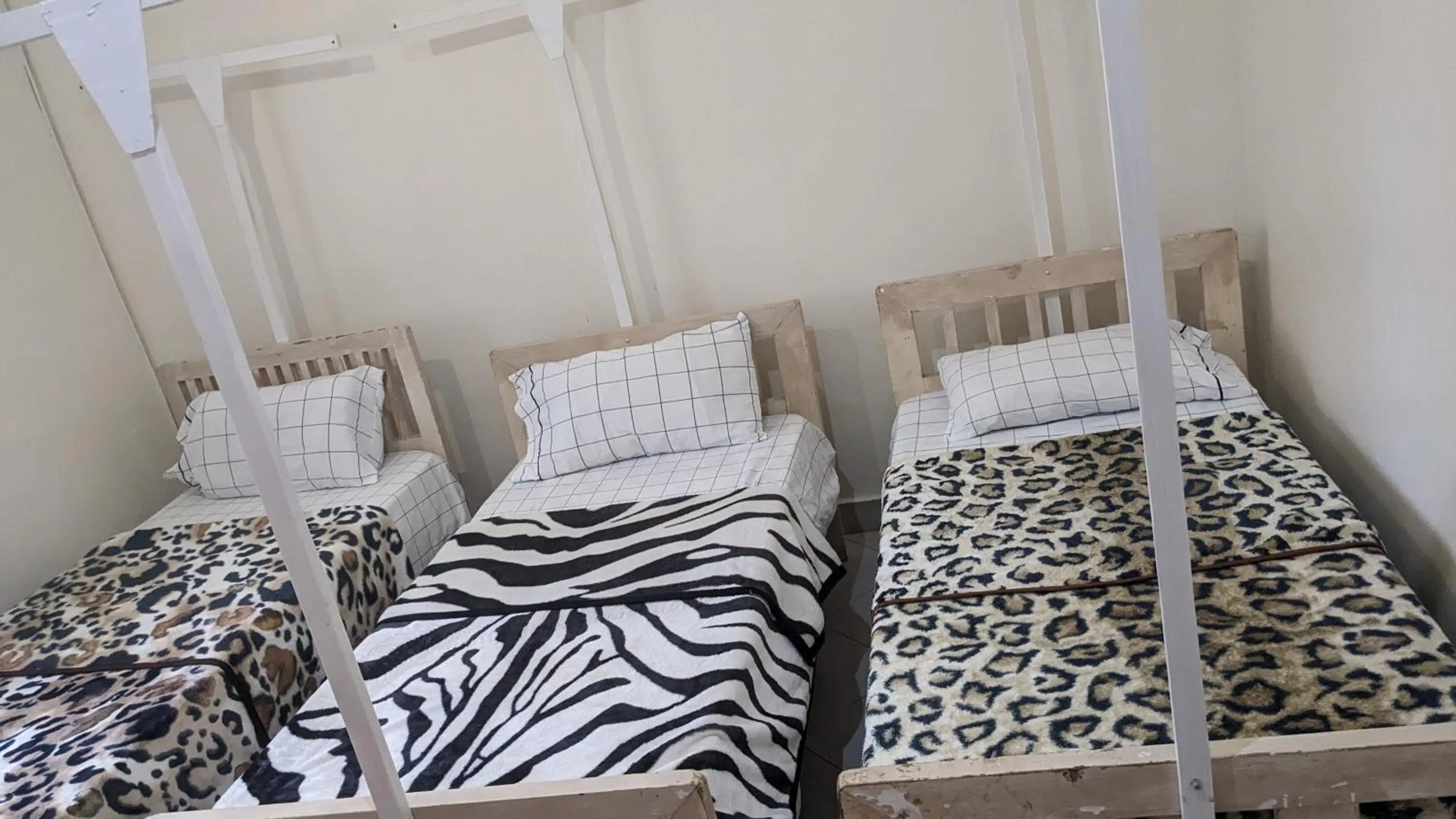 Bed in JACARANDA HOMESTAY