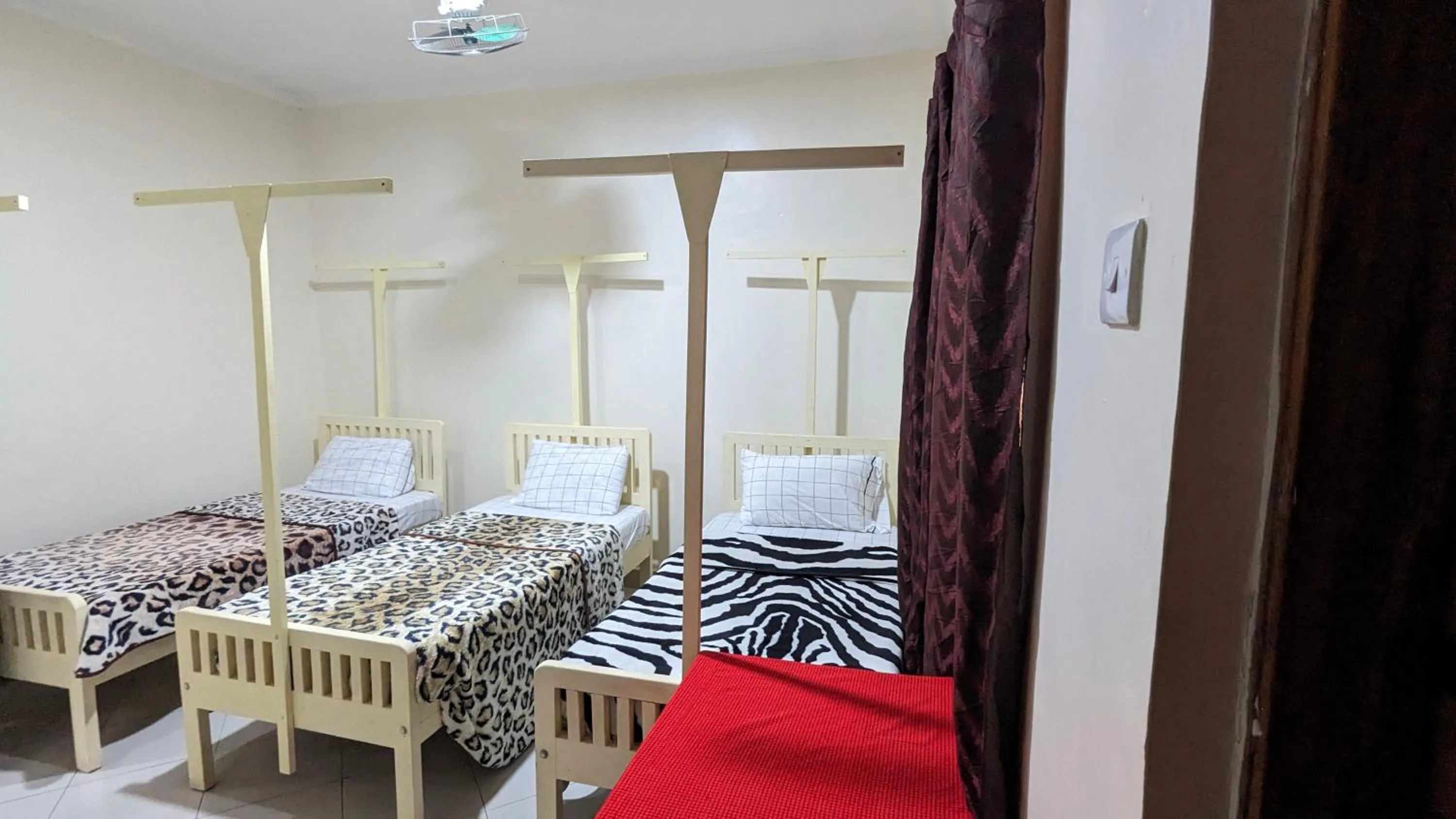 Bed in JACARANDA HOMESTAY