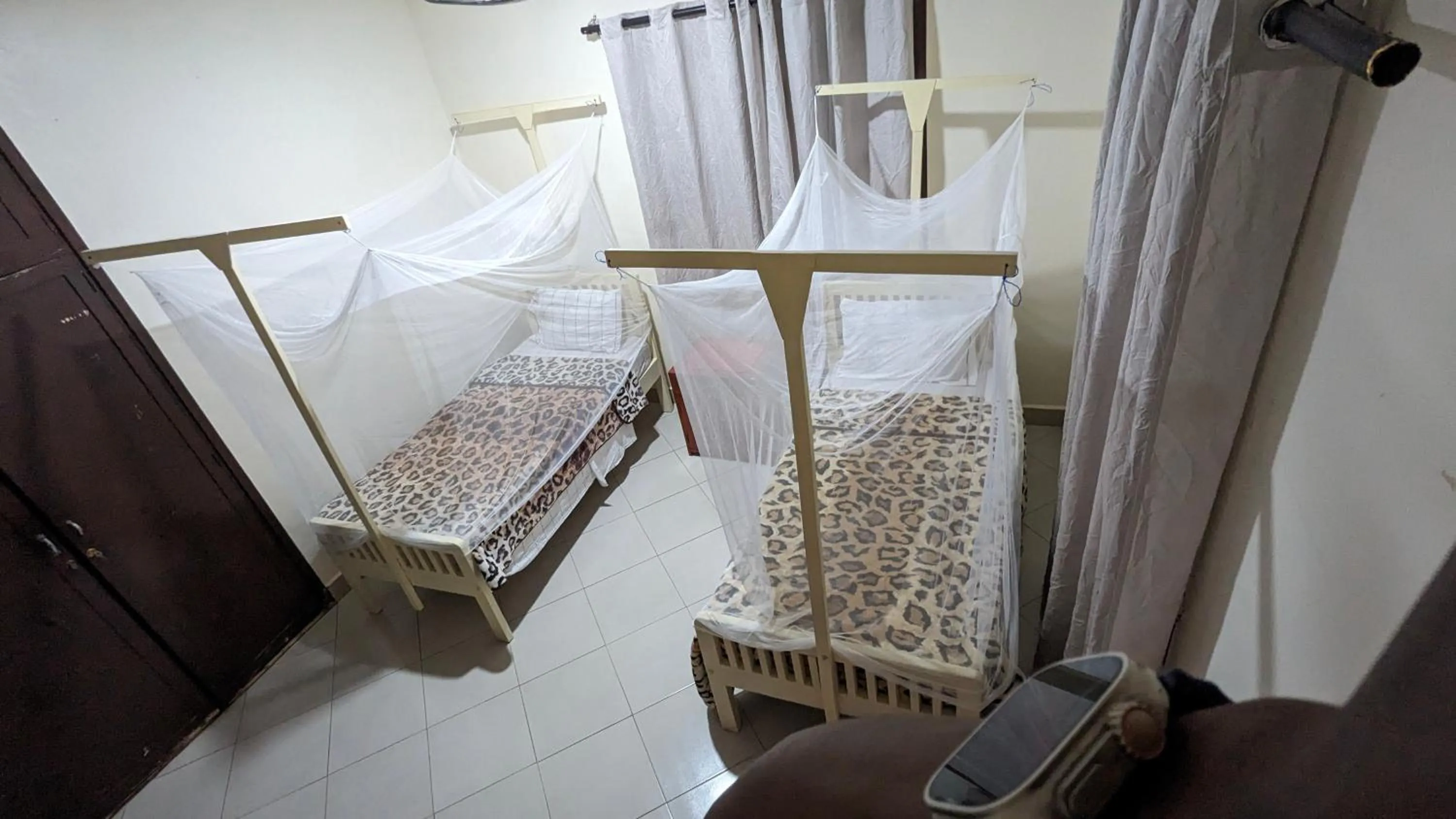 Bed in JACARANDA HOMESTAY