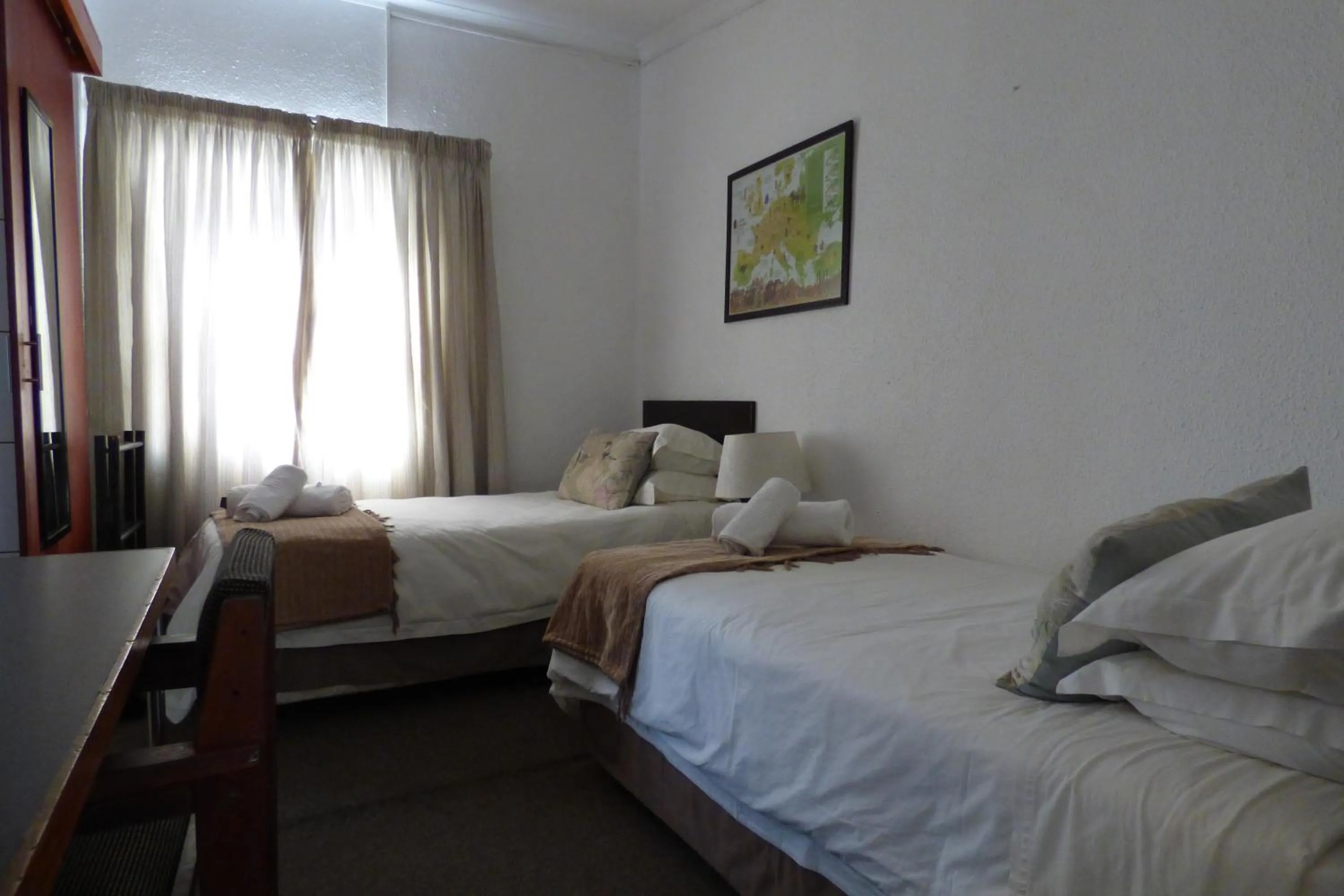 Bed in Pennylane Guest House