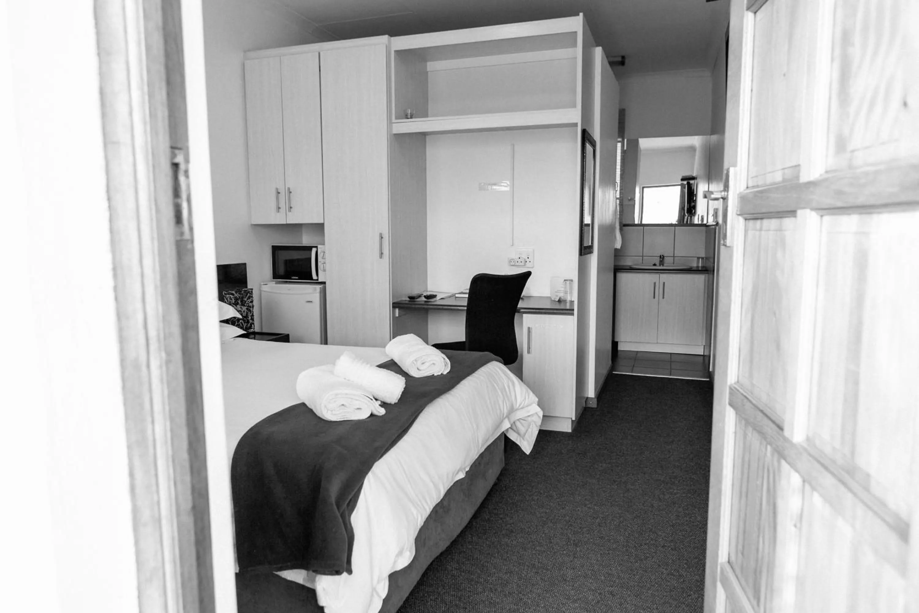 Bed in Pennylane Guest House