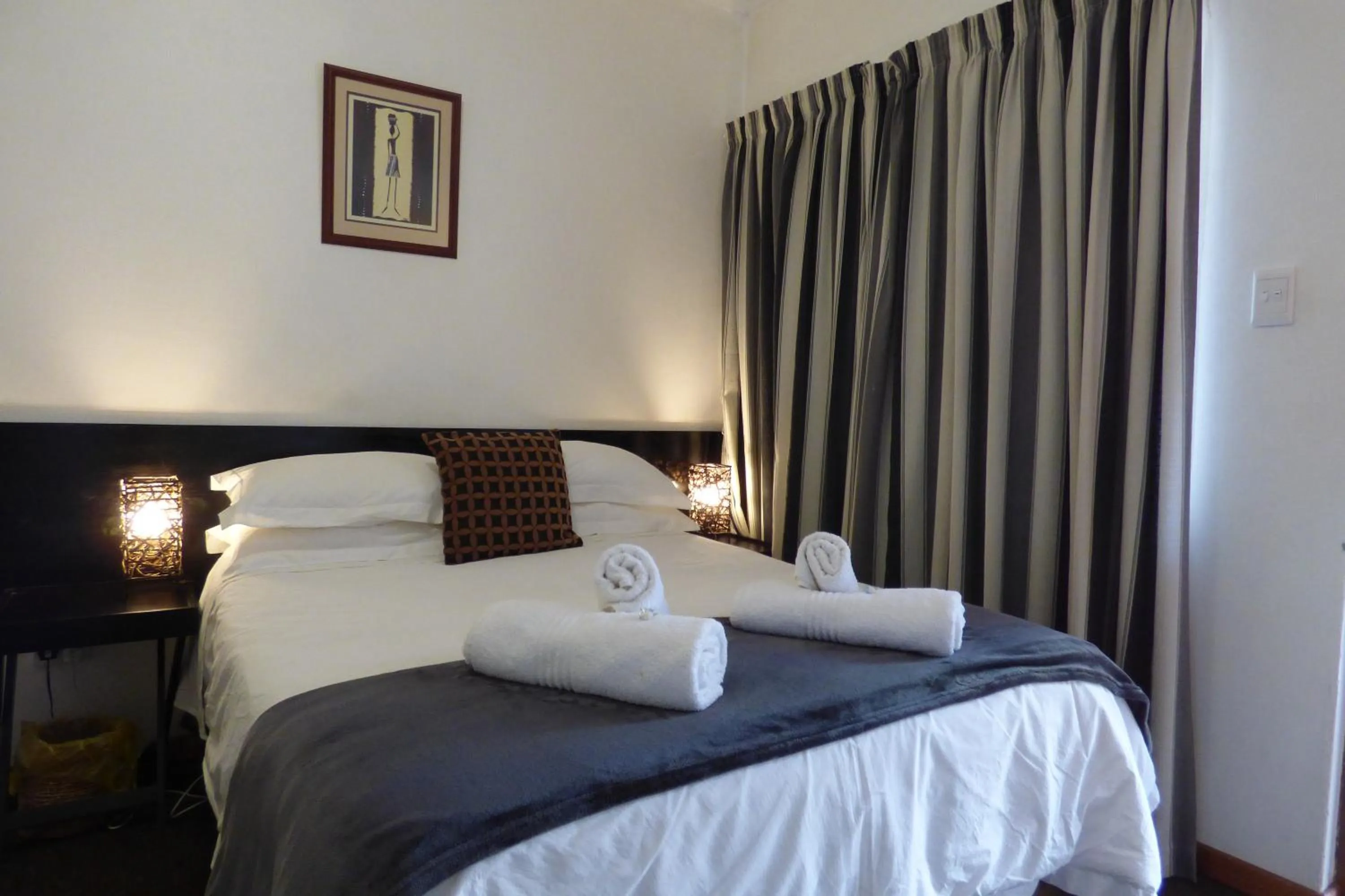 Bed in Pennylane Guest House