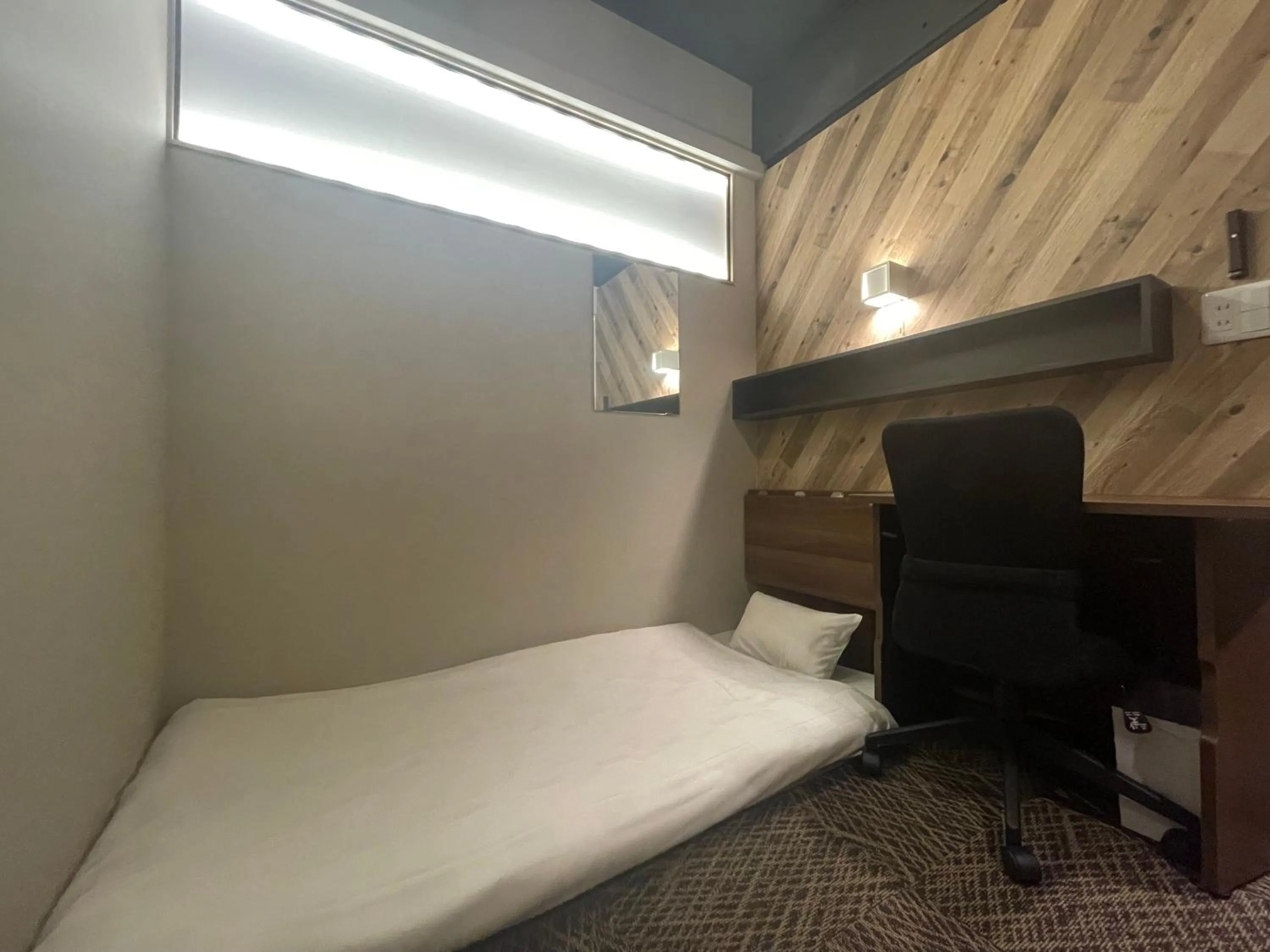 Bedroom, Bed in CAPSULE HOTEL CONTINUE NijojoKita
