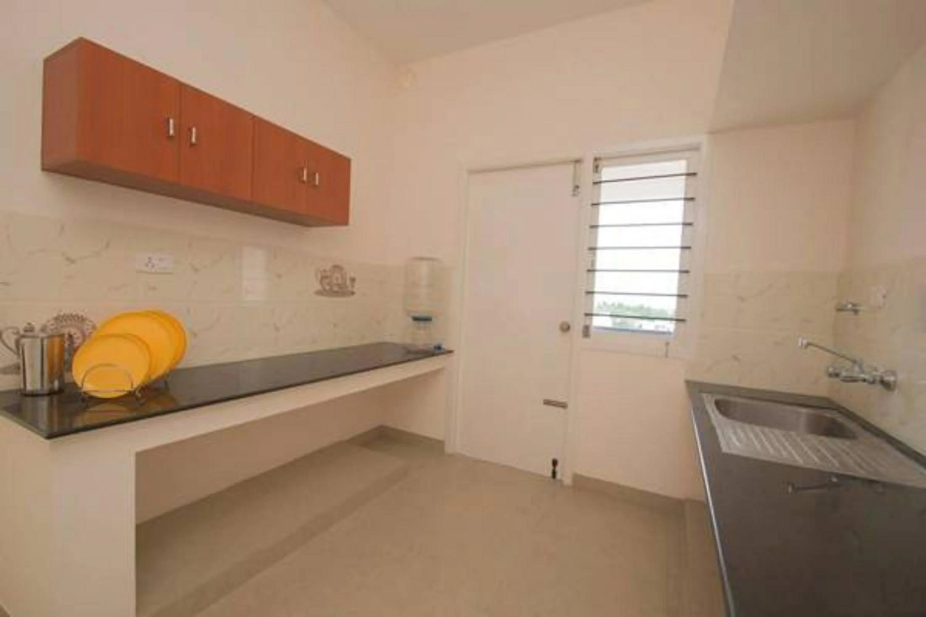 Kitchen or kitchenette in ThulasiRams Service Apartments