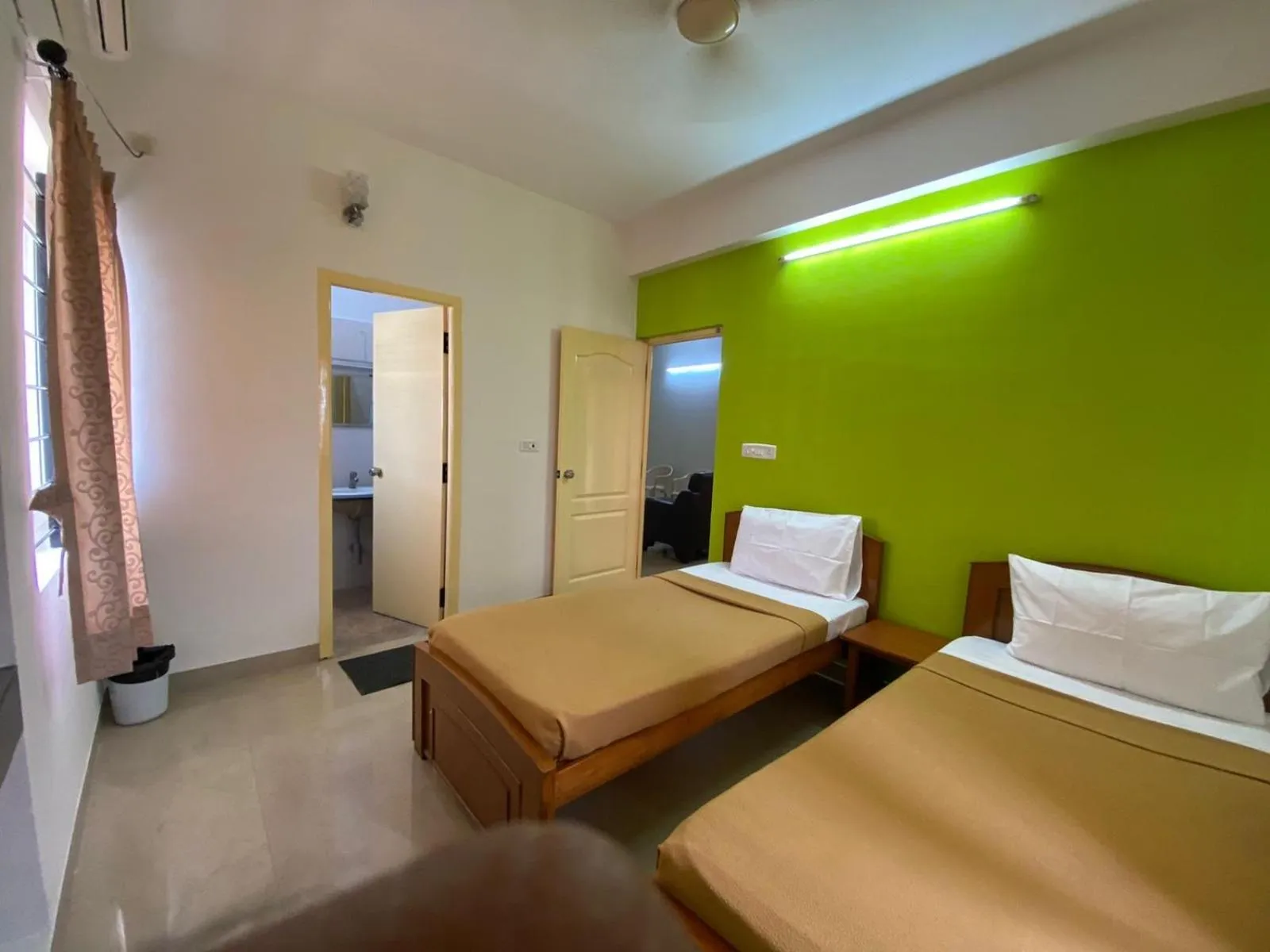 Bed in ThulasiRams Service Apartments