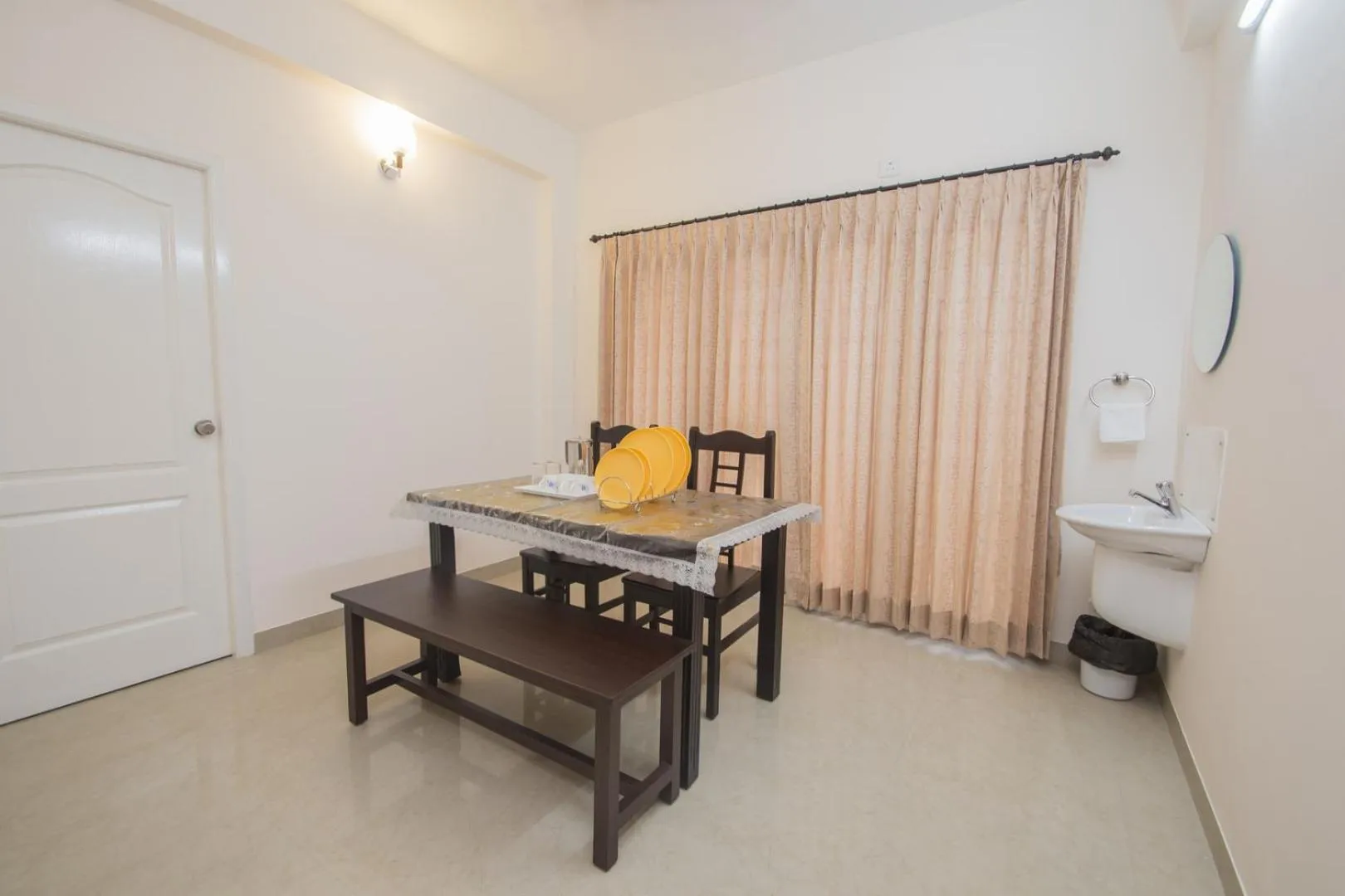Dining area in ThulasiRams Service Apartments
