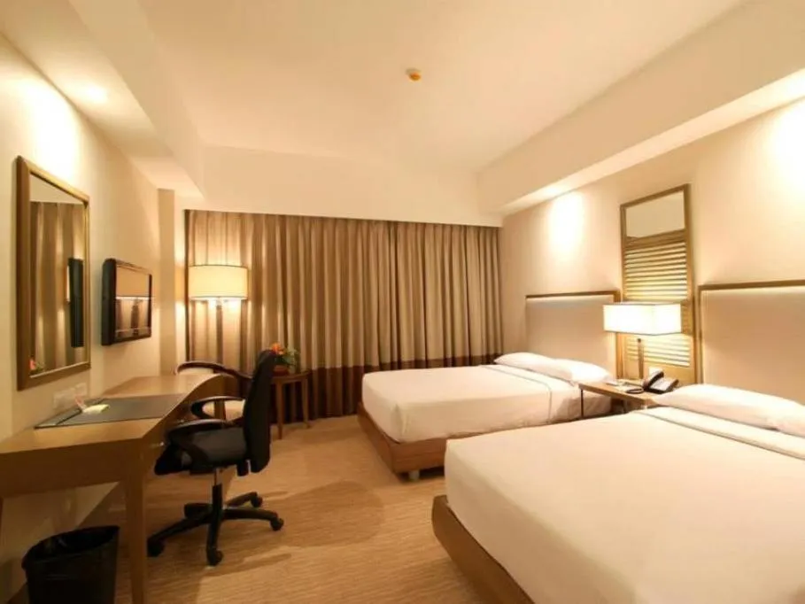 Bed in Garden Orchid Hotel & Resort Corp.