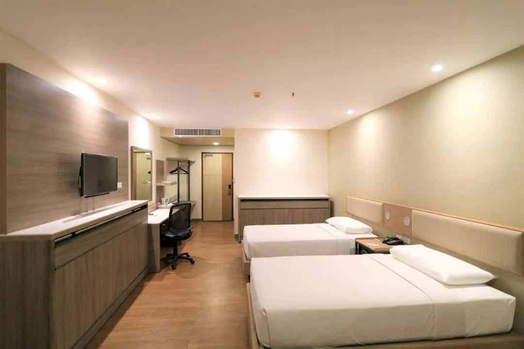 Bed in Garden Orchid Hotel & Resort Corp.