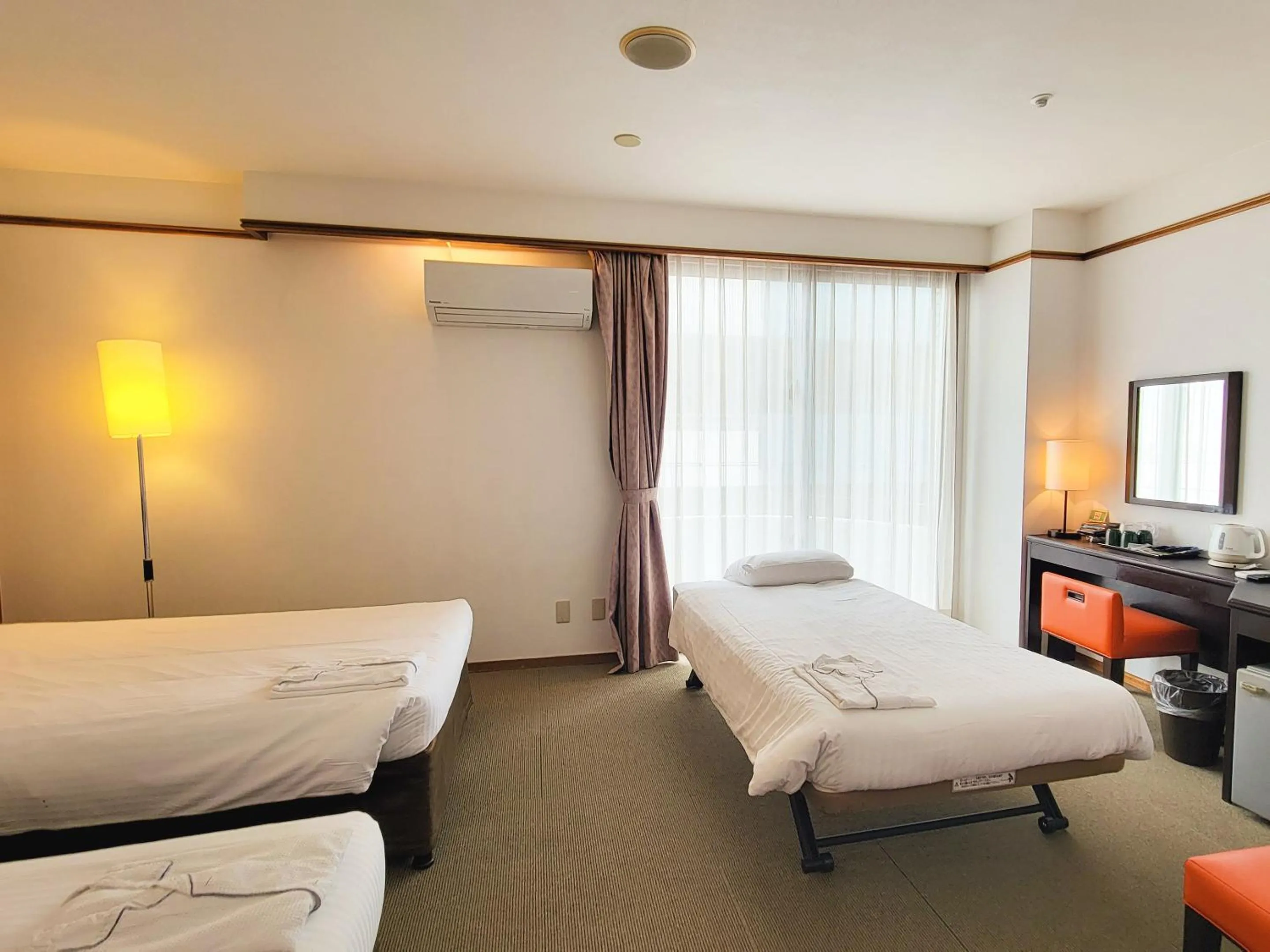 Bed in Hotel Resonex Naha