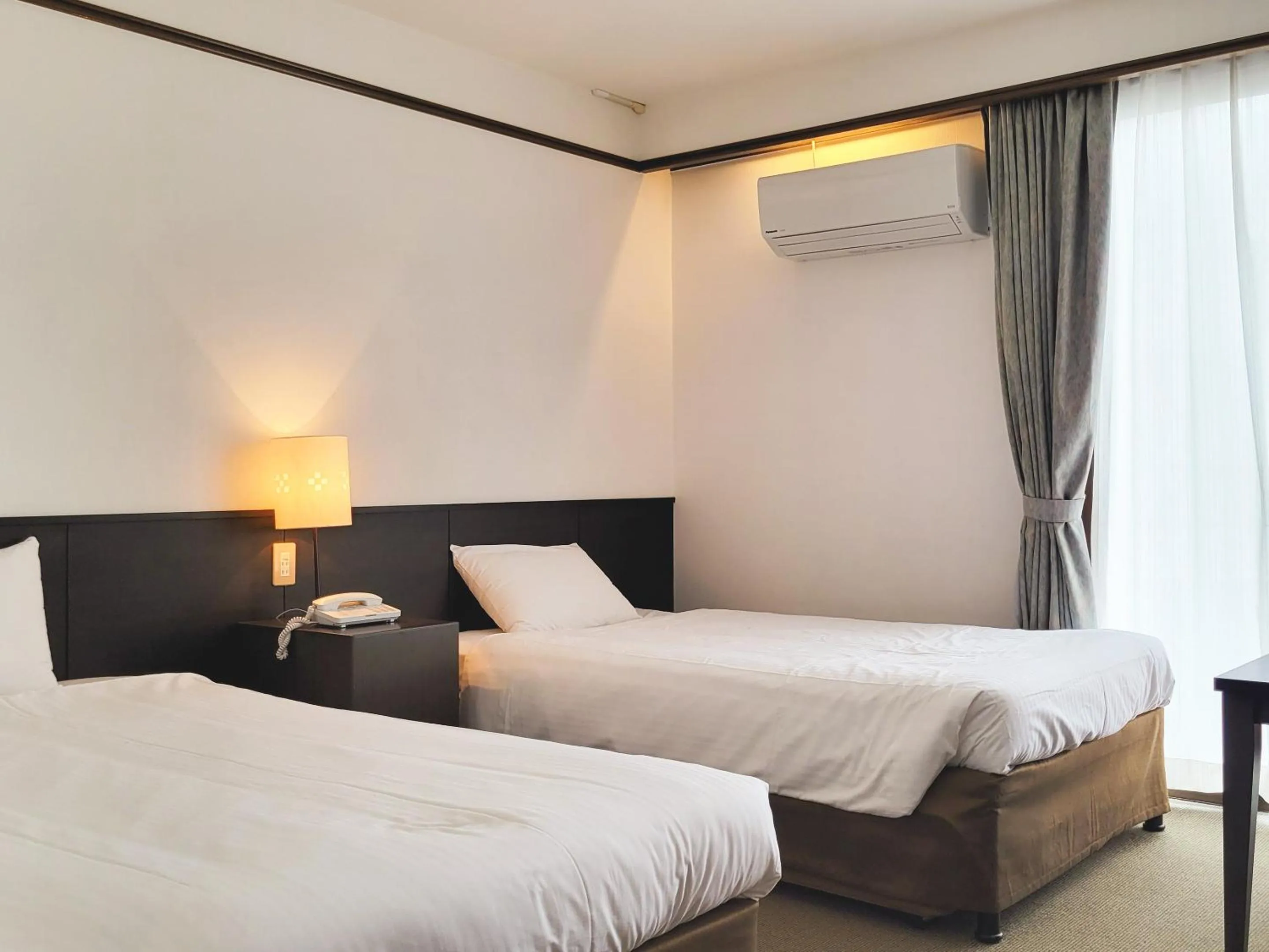 Bed in Hotel Resonex Naha