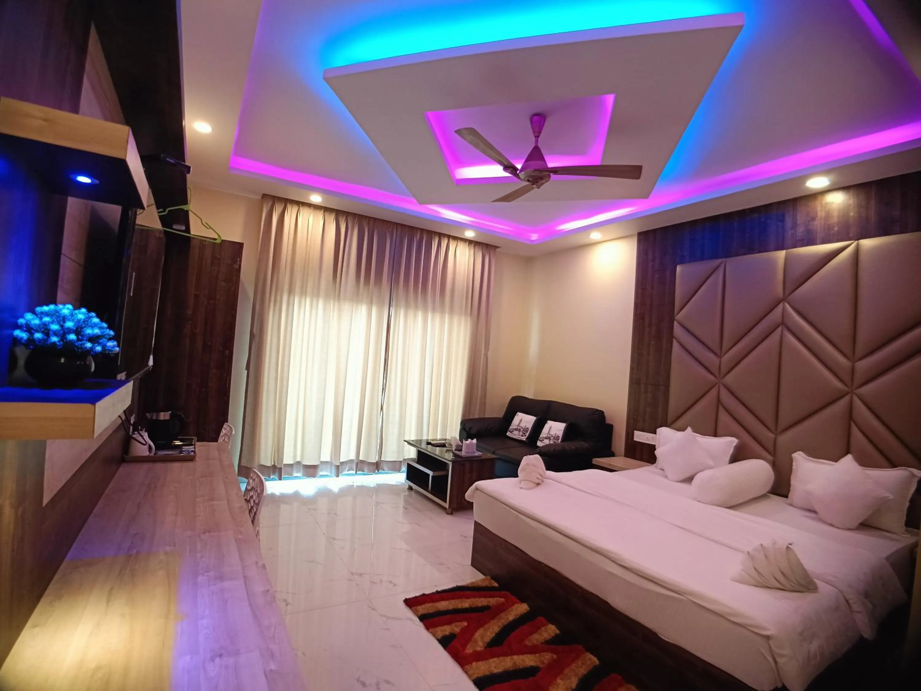 Bed in The Triton Beach Resort