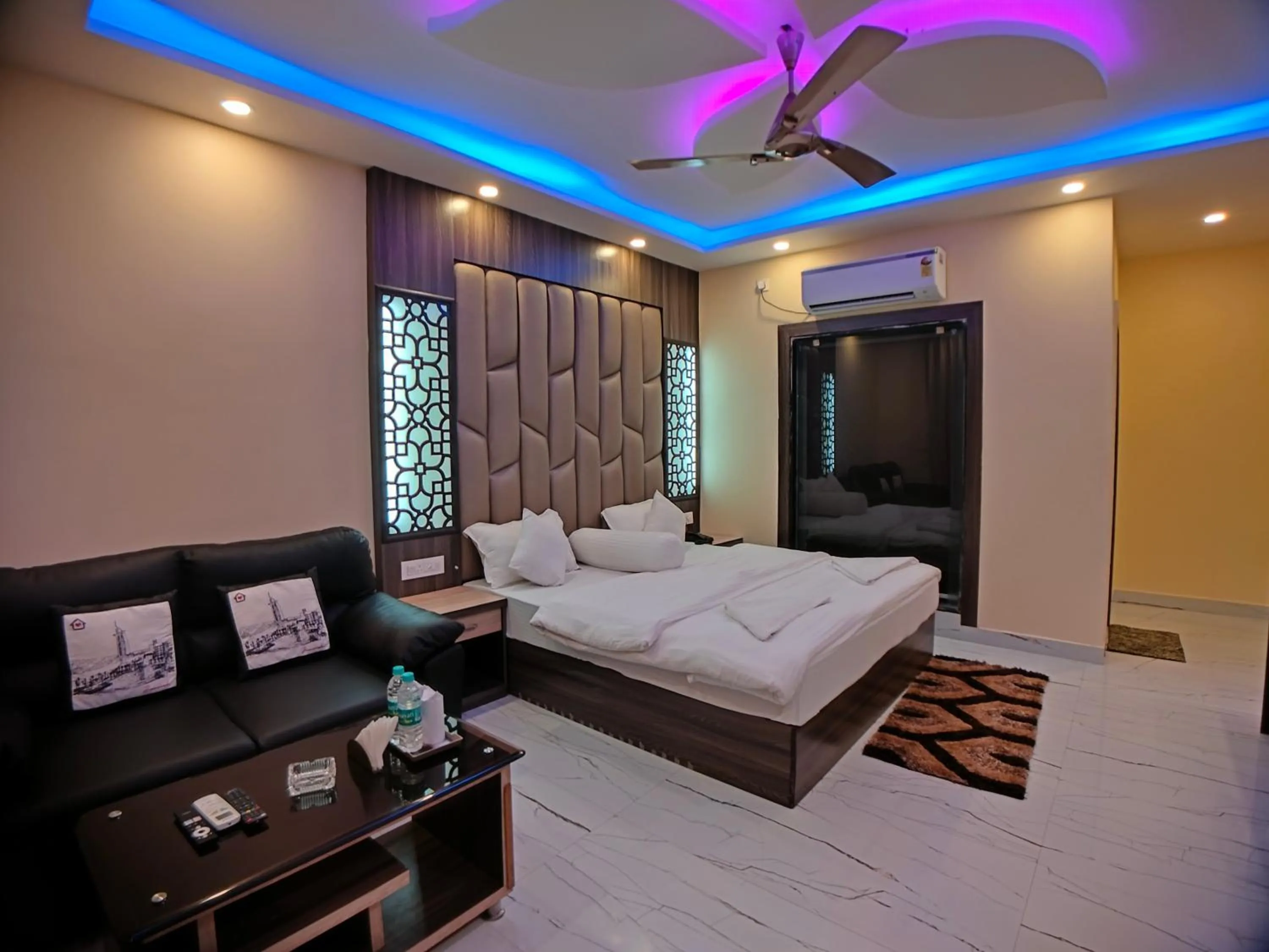 Bed in The Triton Beach Resort