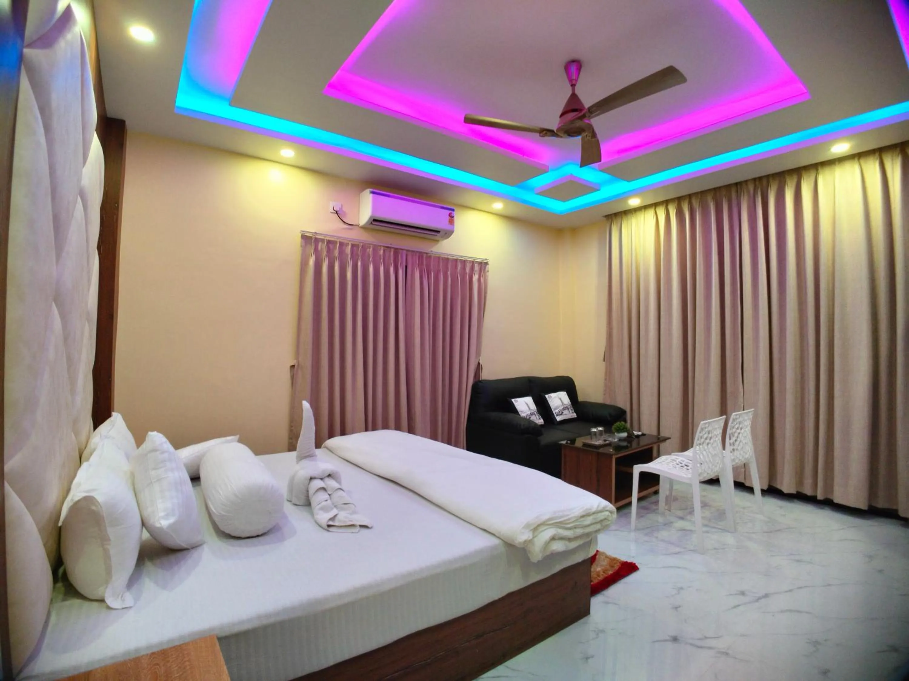 Bed in The Triton Beach Resort