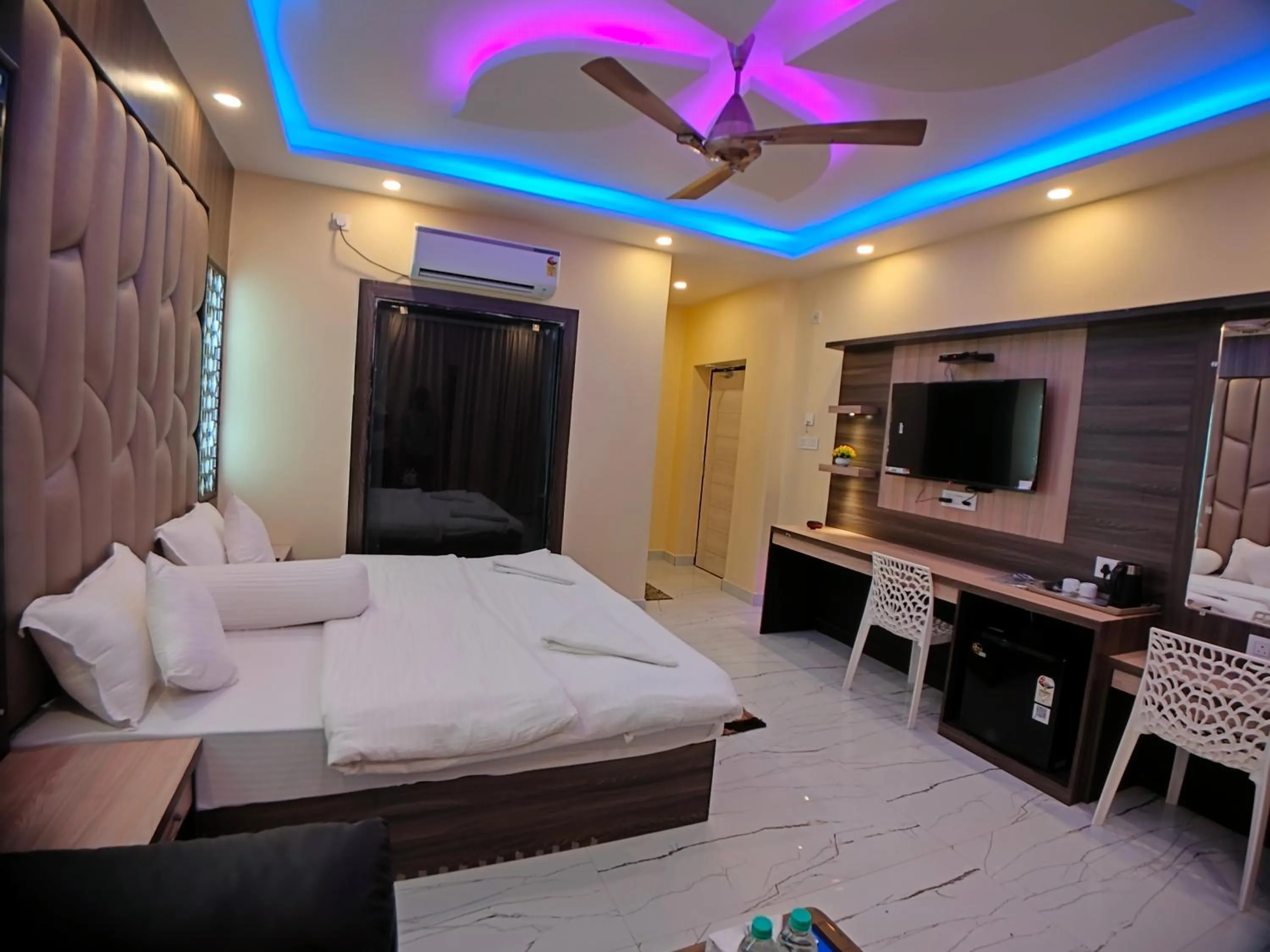 Bed in The Triton Beach Resort