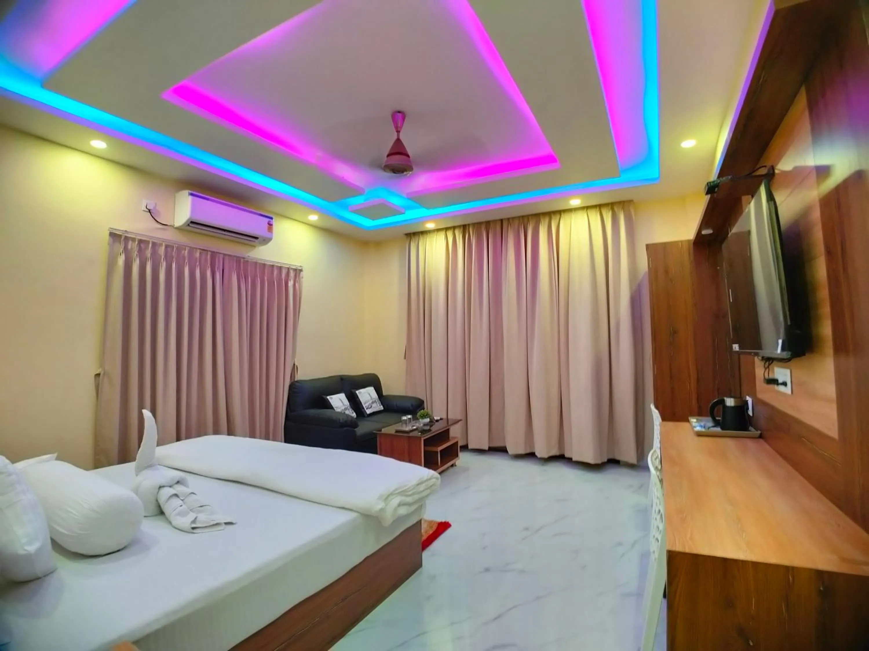 Bed in The Triton Beach Resort