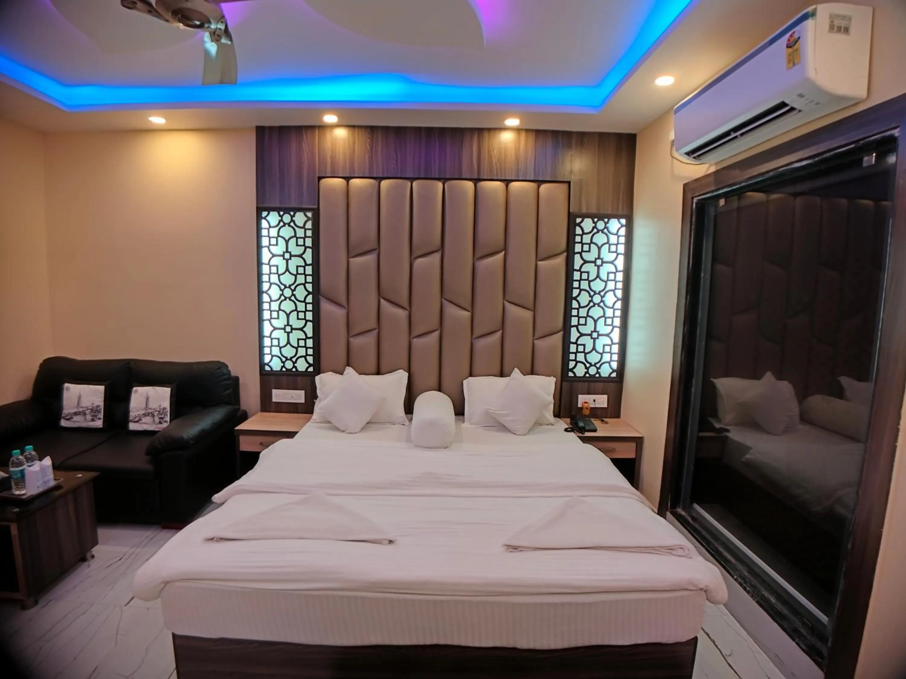 Bed in The Triton Beach Resort