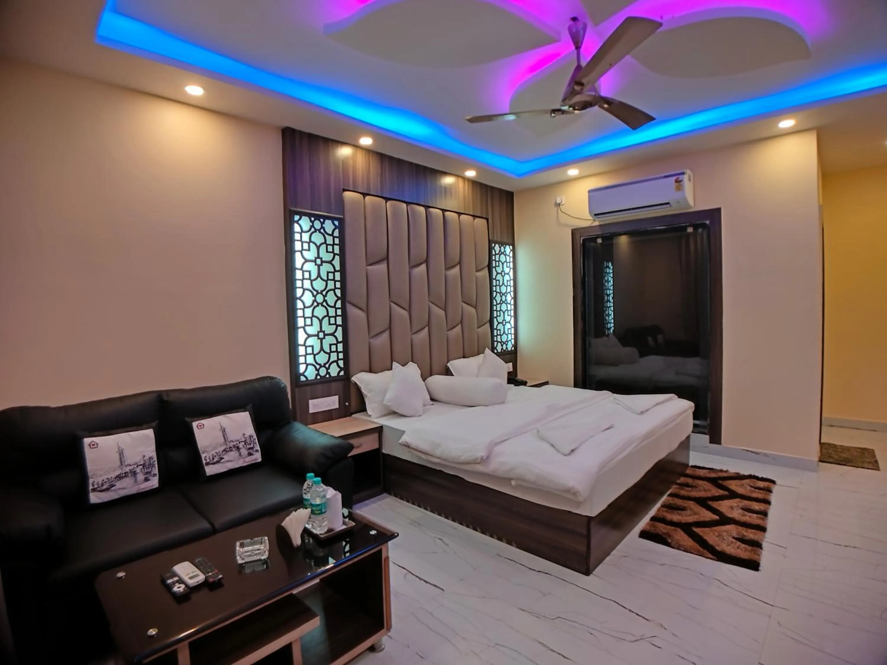 Bed in The Triton Beach Resort