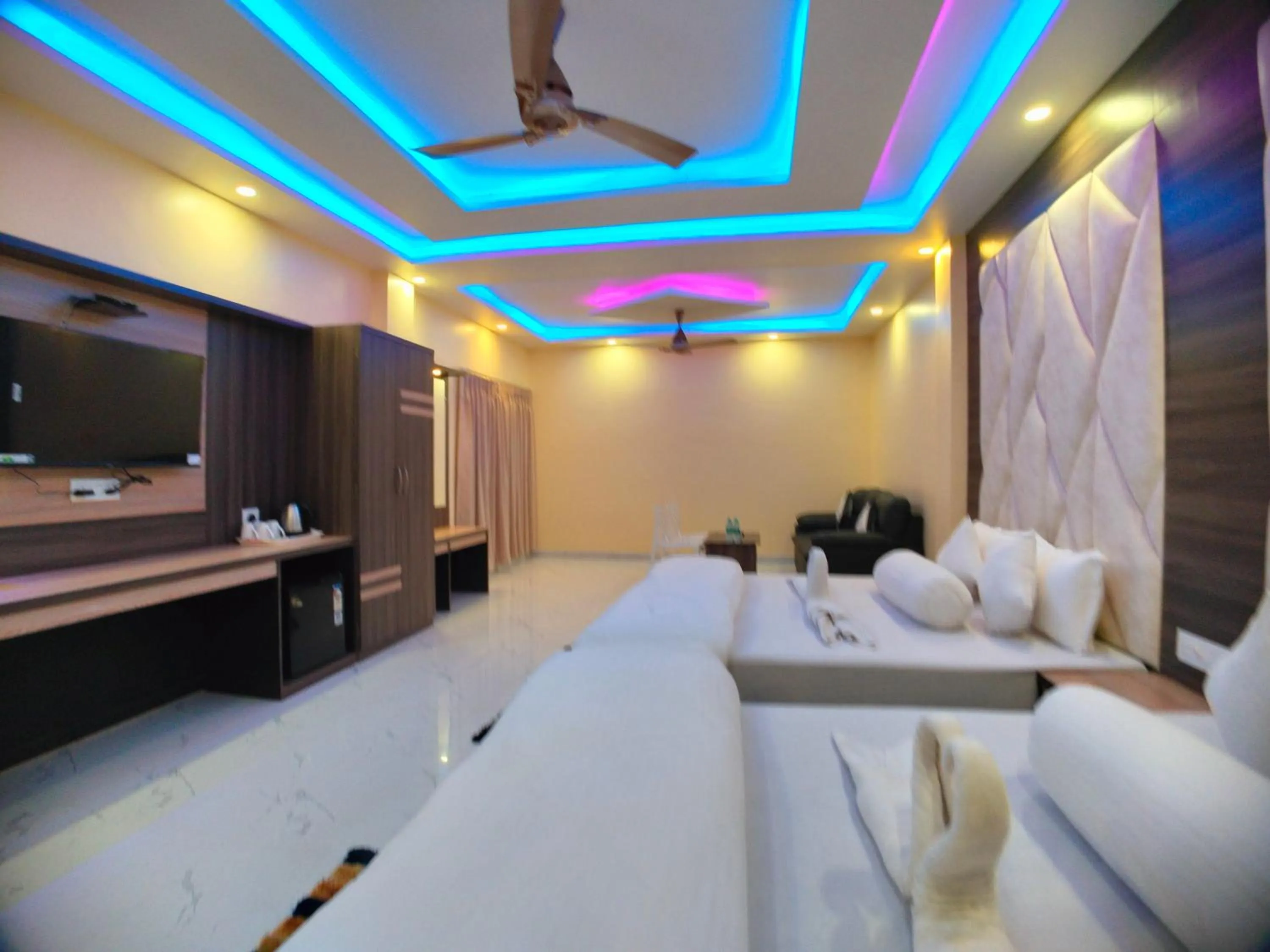 Bed in The Triton Beach Resort