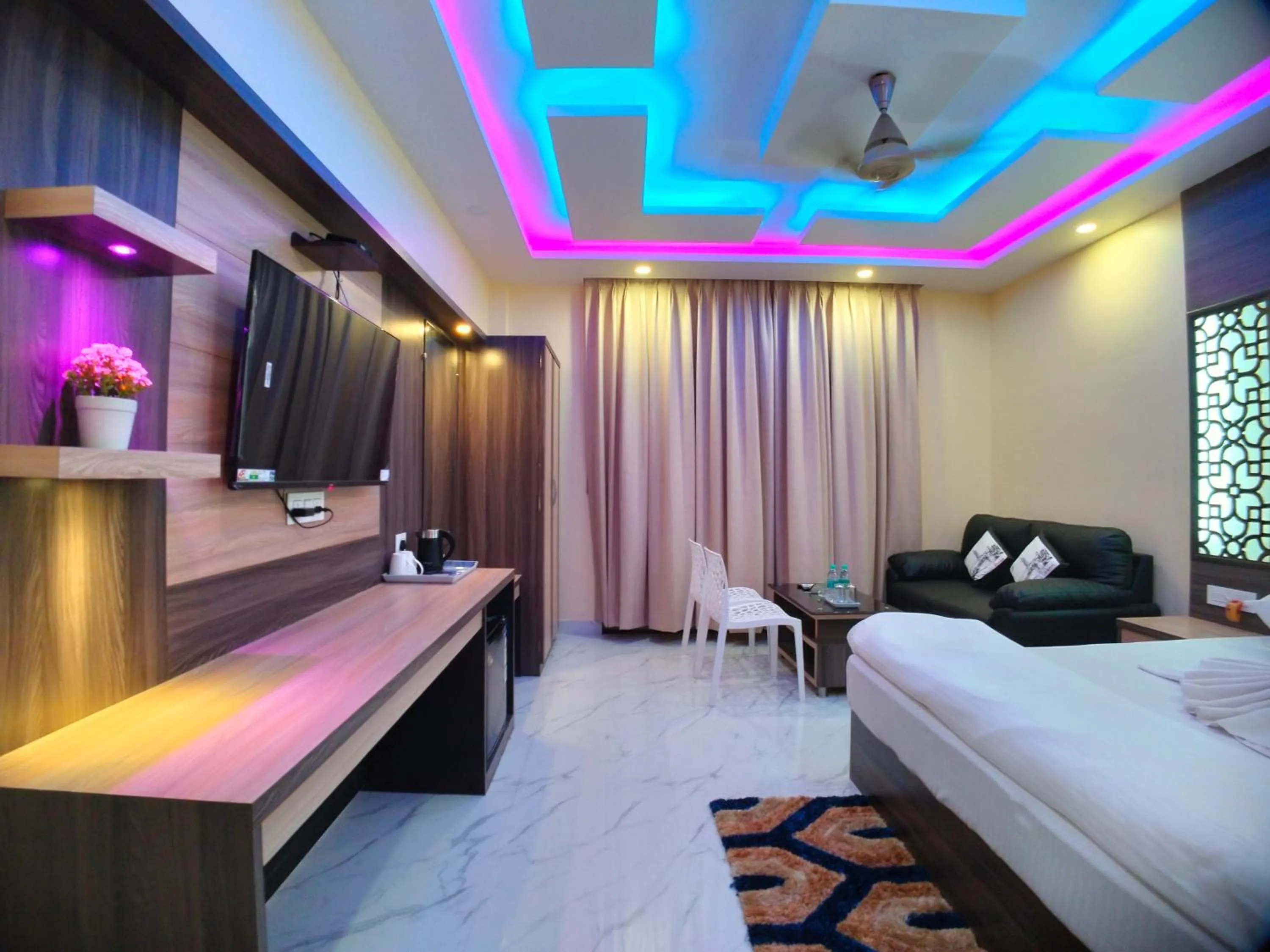 Bed in The Triton Beach Resort