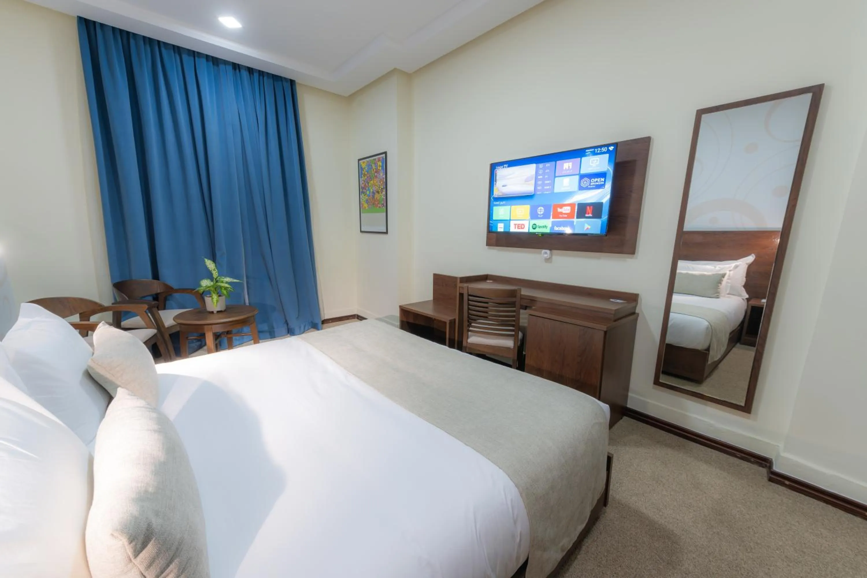 Communal lounge/ TV room, Bed in Olympic Inn Casablanca