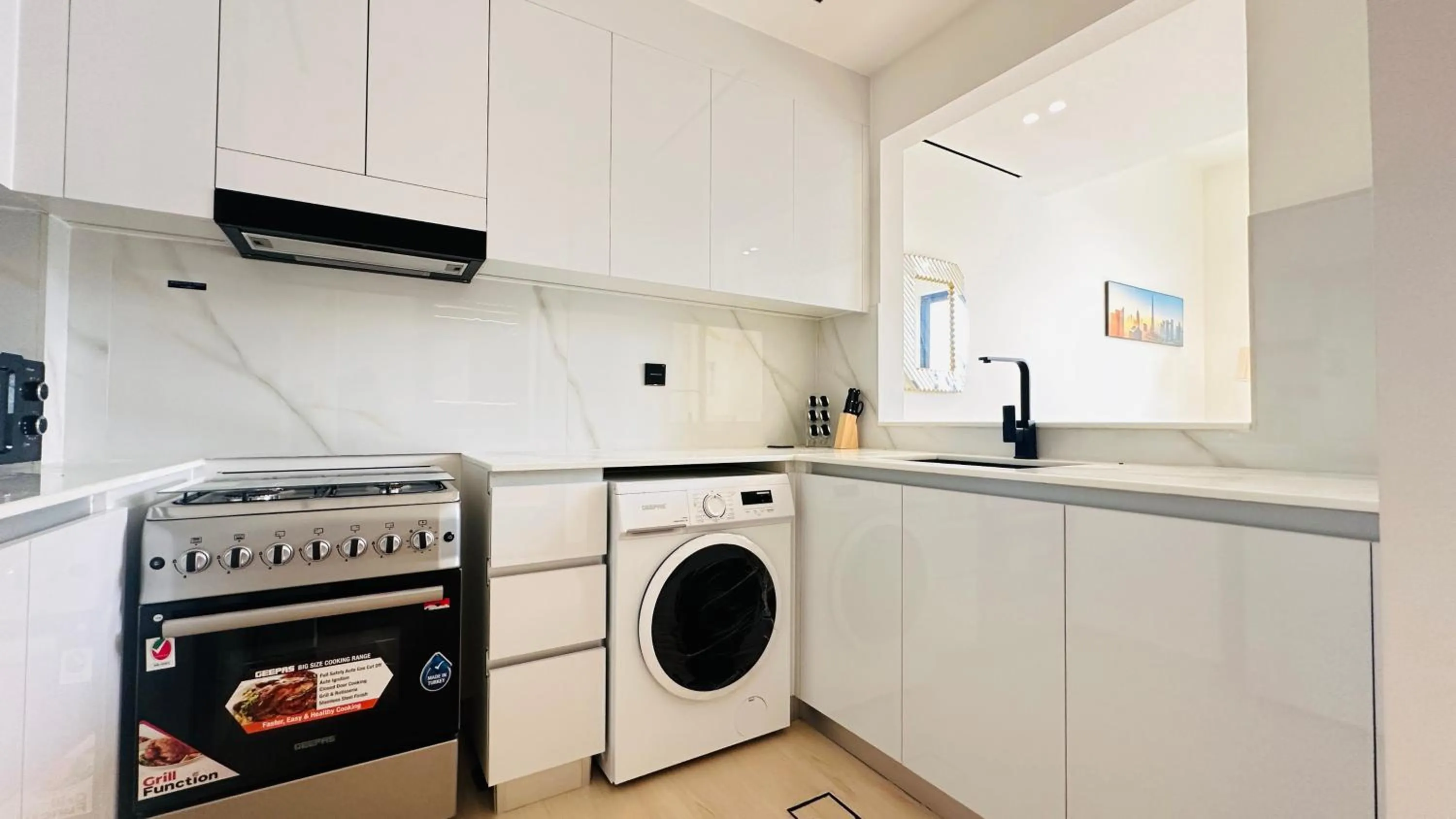 Kitchen or kitchenette in OYO 1291 Home Fully Furnished 1bed Apt @JVC